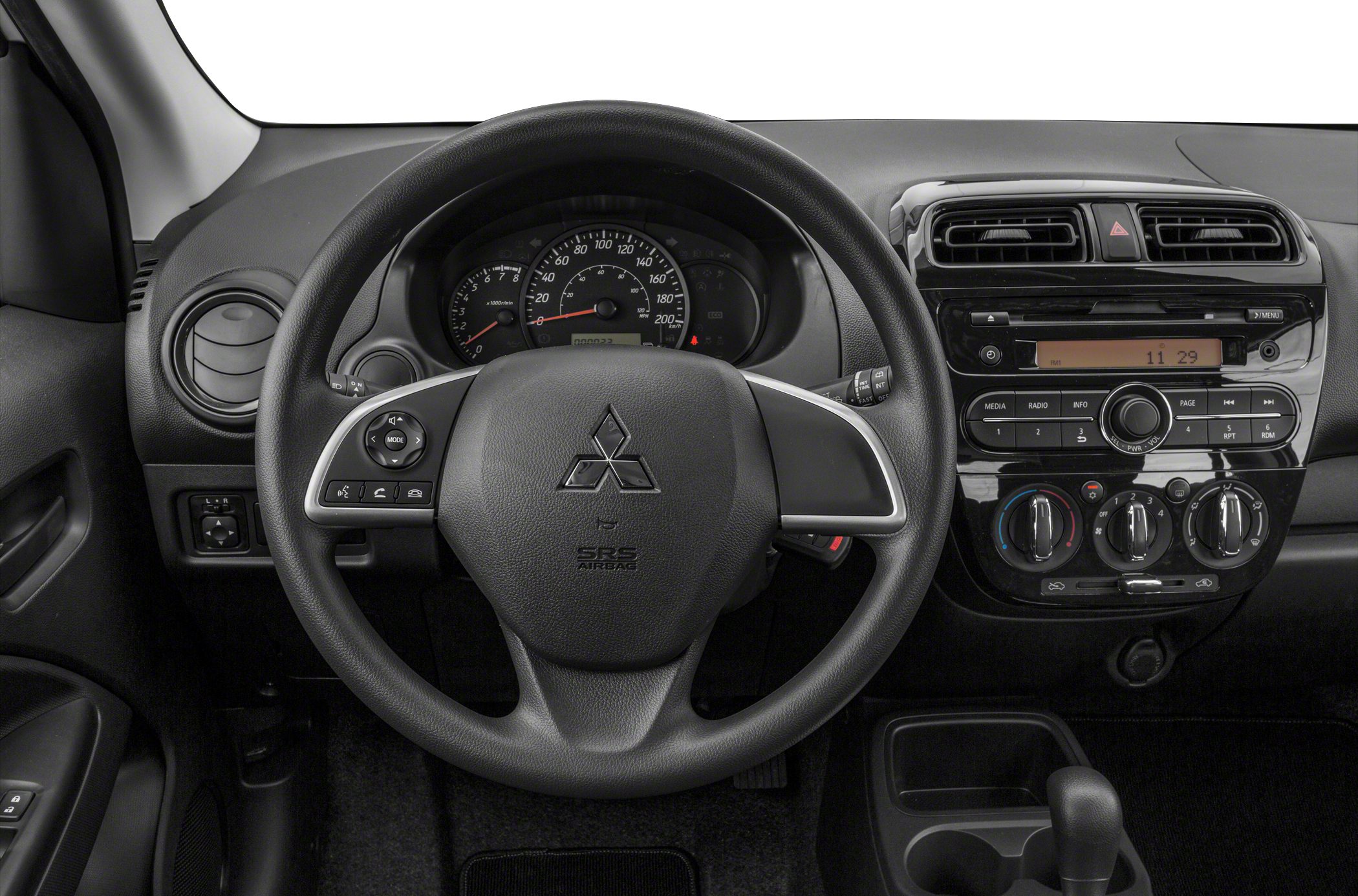 Steering wheel, instrument cluster, and dashboard control panel in compact hatchback interior