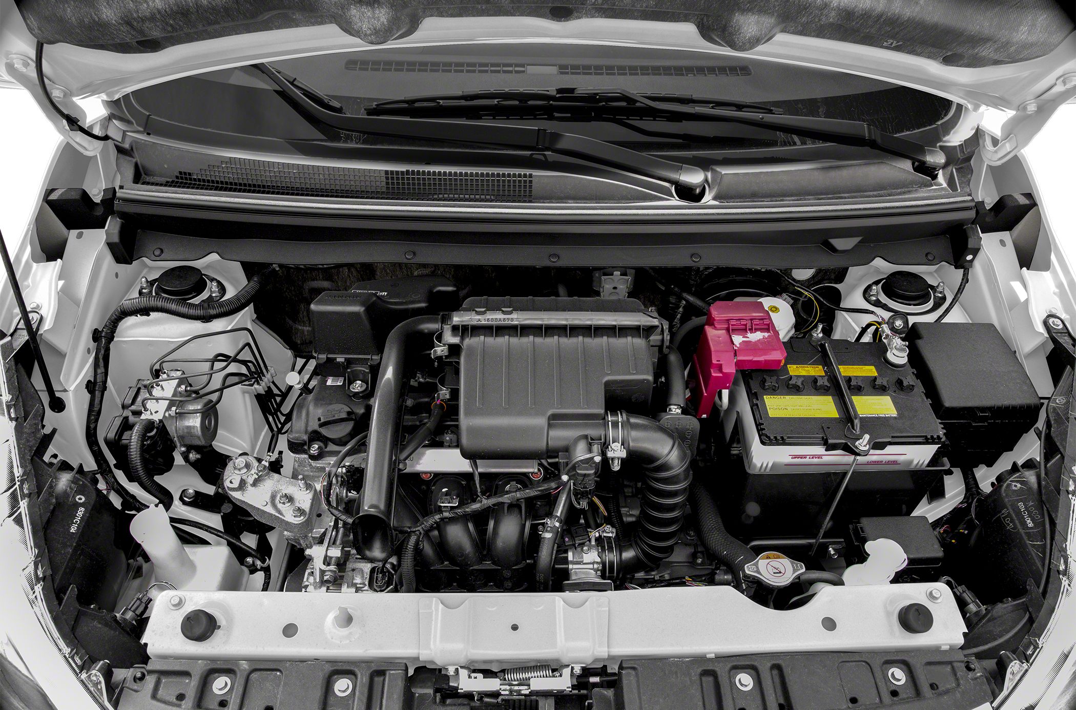 Compact car engine bay with visible battery and intake system