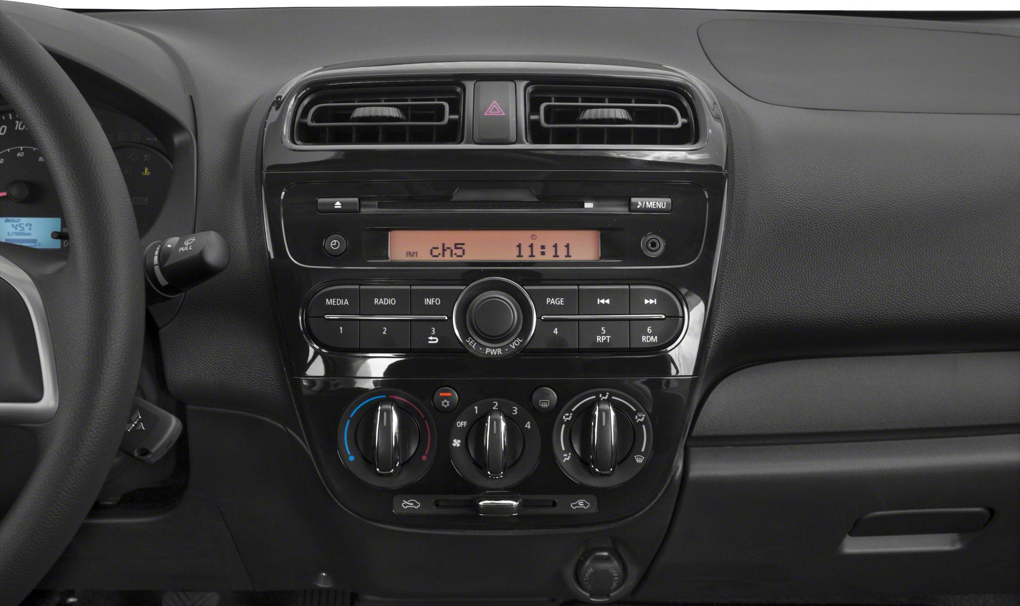 Dashboard and center console controls with air vents and audio system