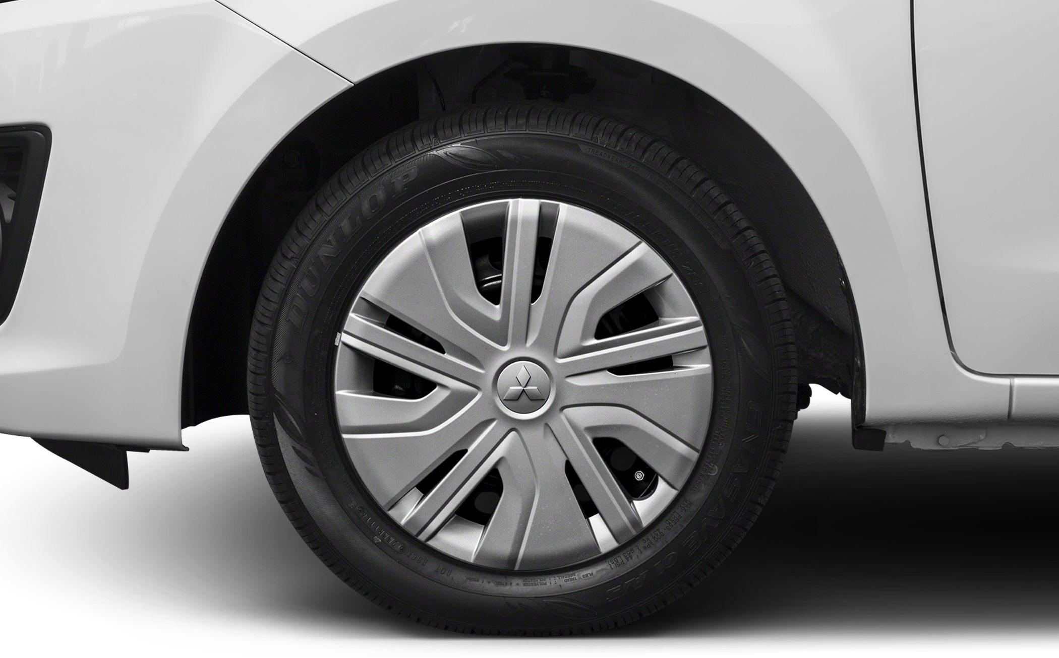 Close-up of a car wheel with hubcap and tire