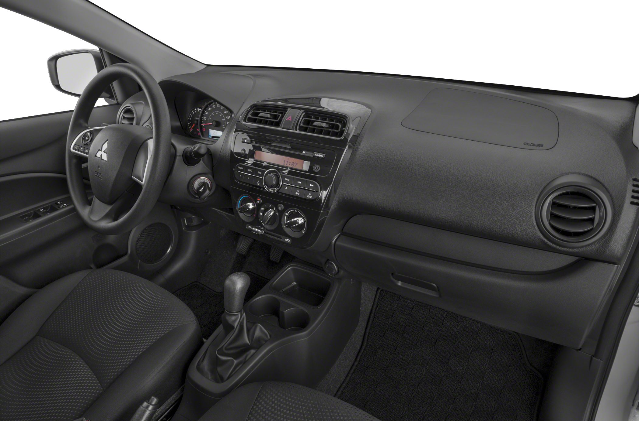 Dashboard with manual gear shift and air vents in a compact car interior