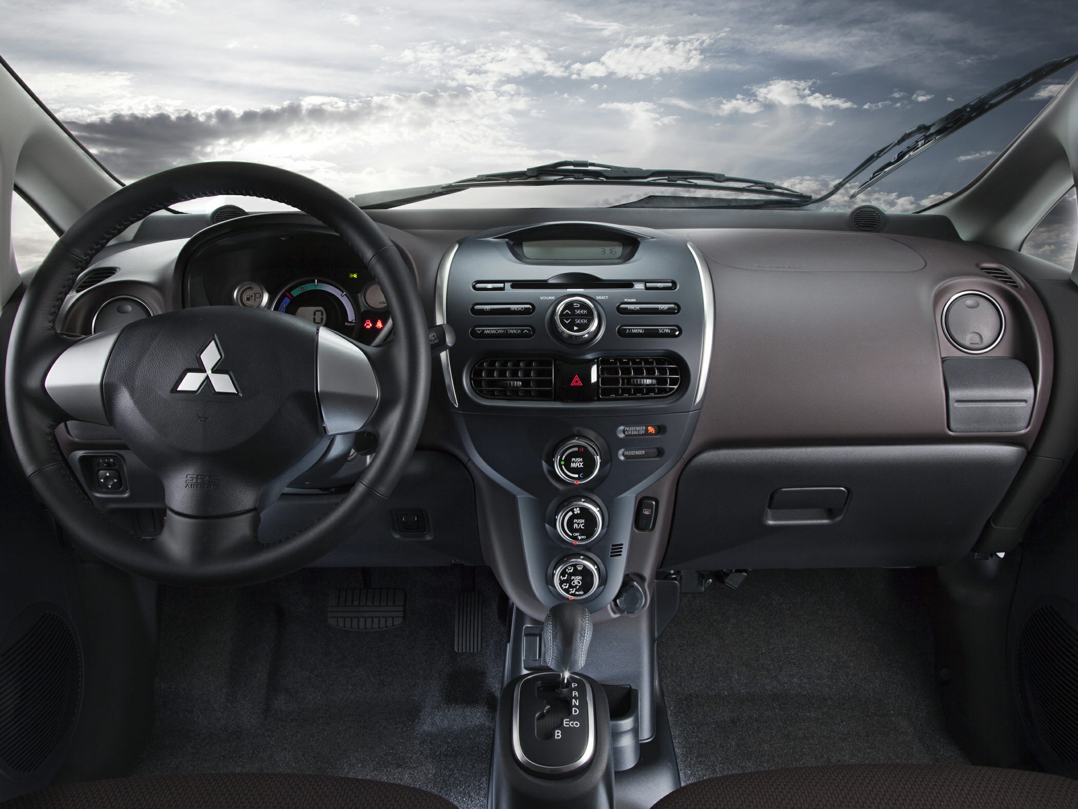Dashboard and center console layout with steering wheel and gear shift