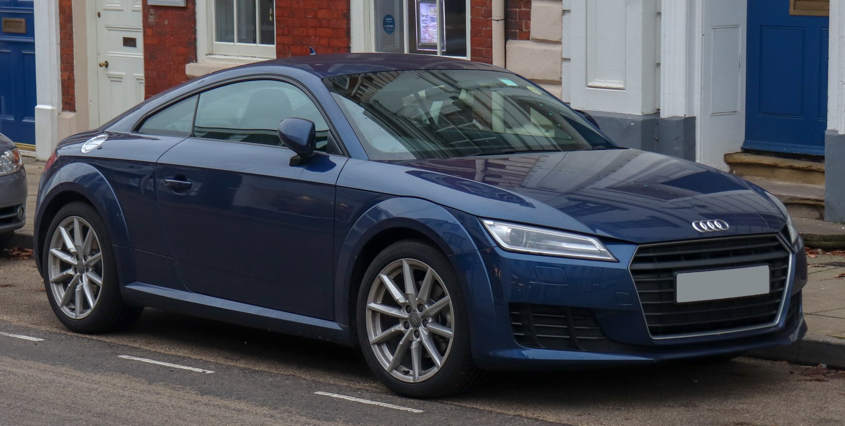 Sporty coupe with sharp LED headlights and distinctive grille