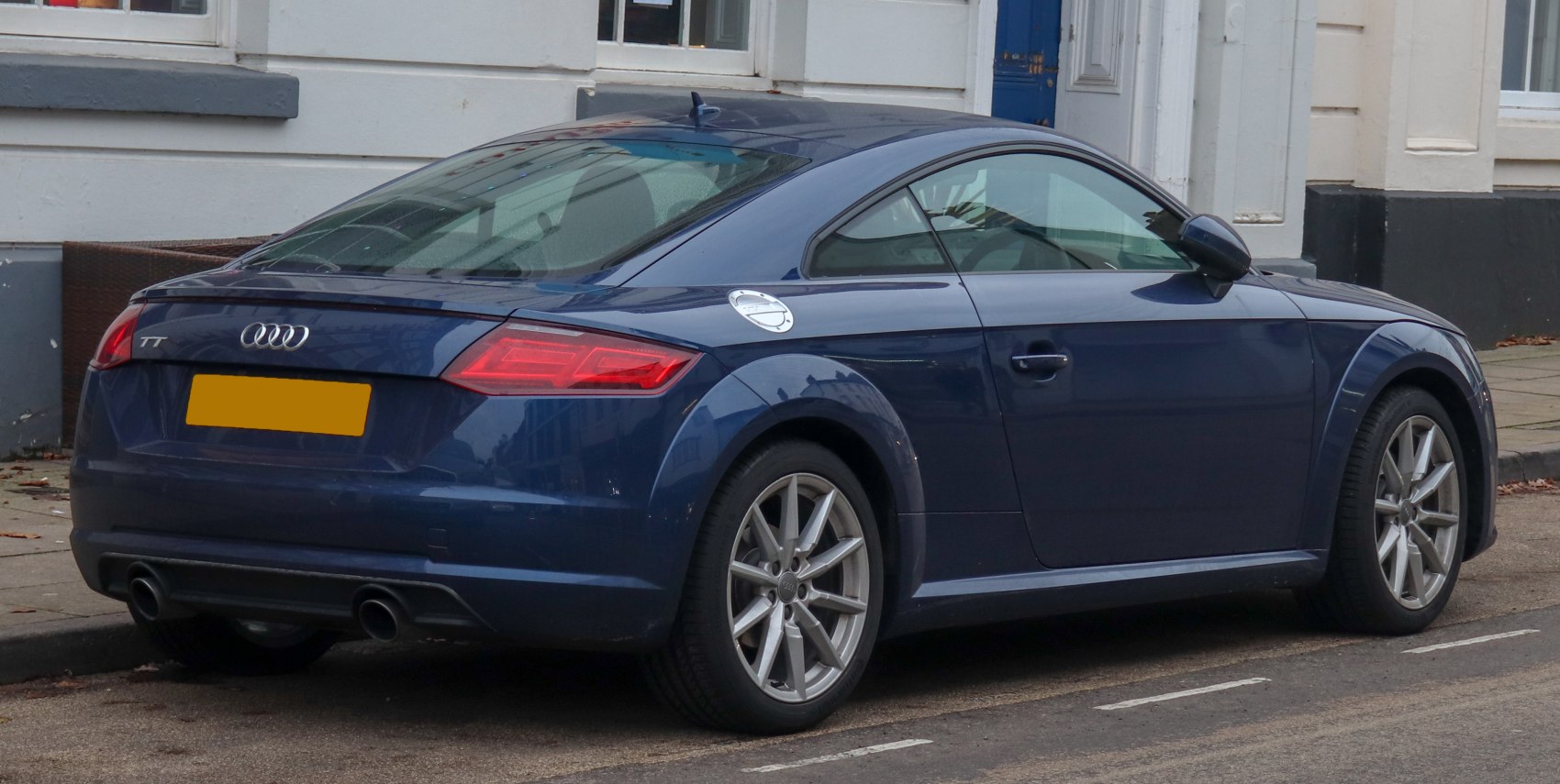 Rear side angle with dual exhaust and alloy wheels