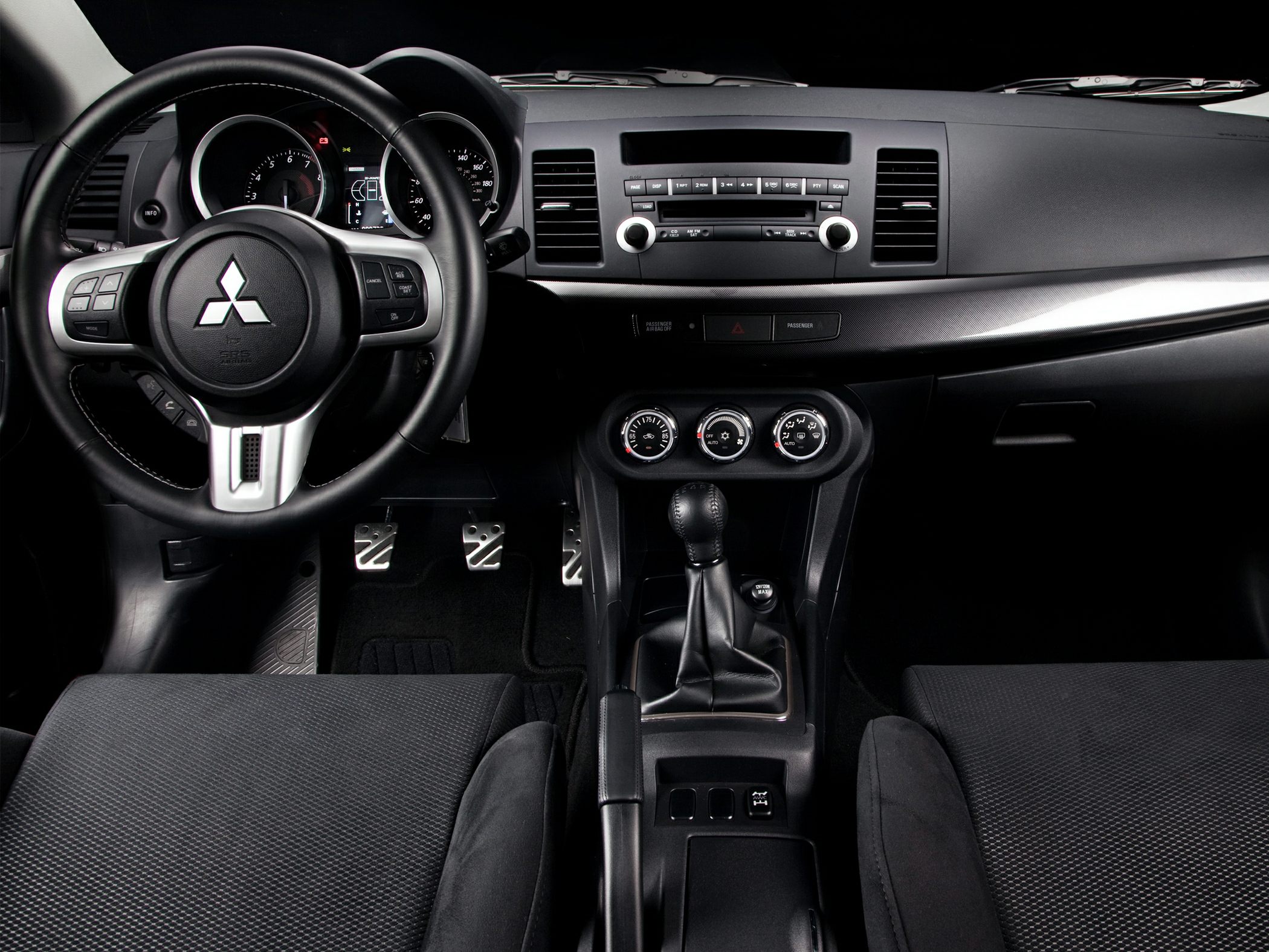 Sporty dashboard with manual gear shift and control dials
