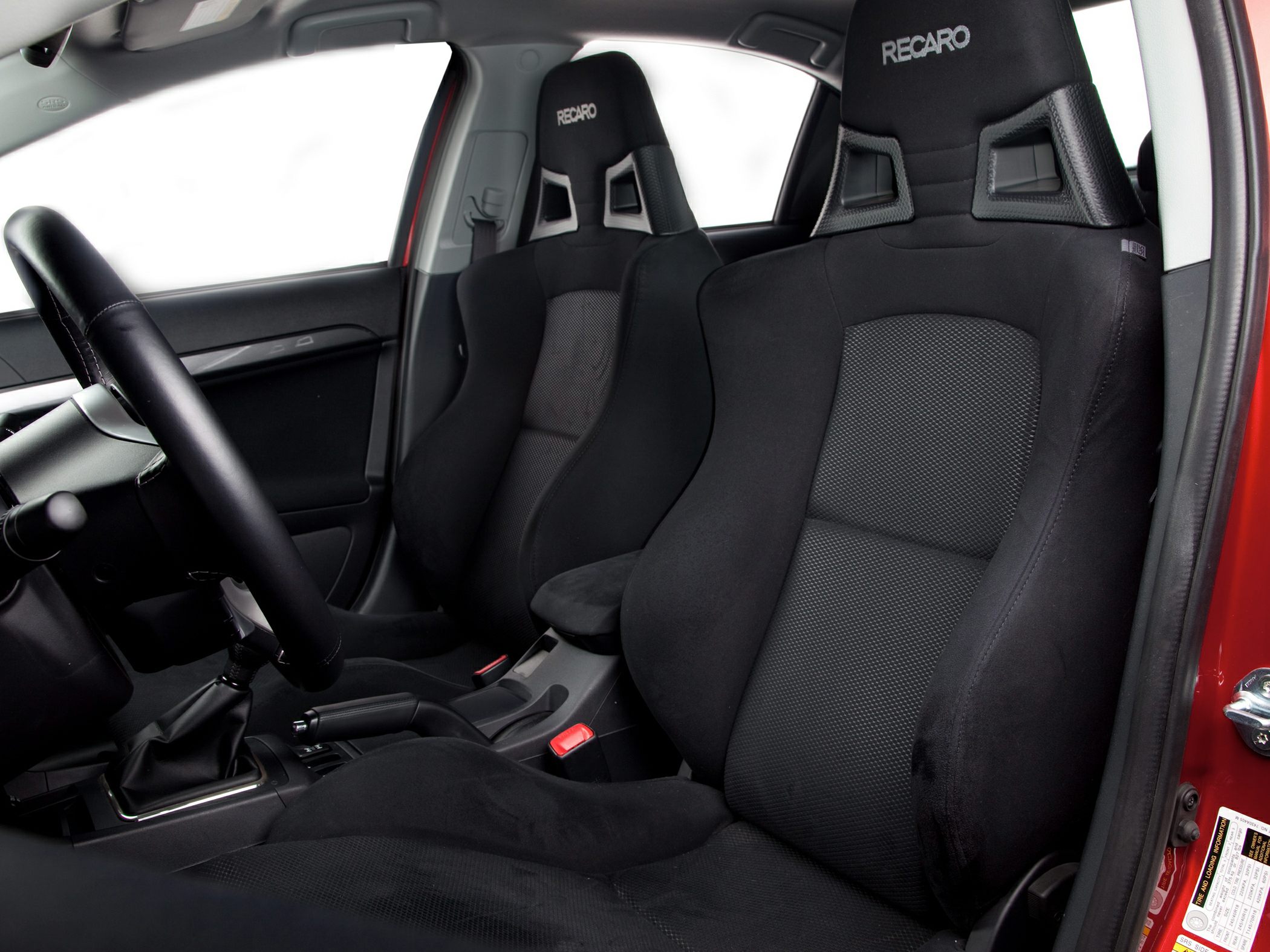 Recaro bucket racing seats and manual transmission interior