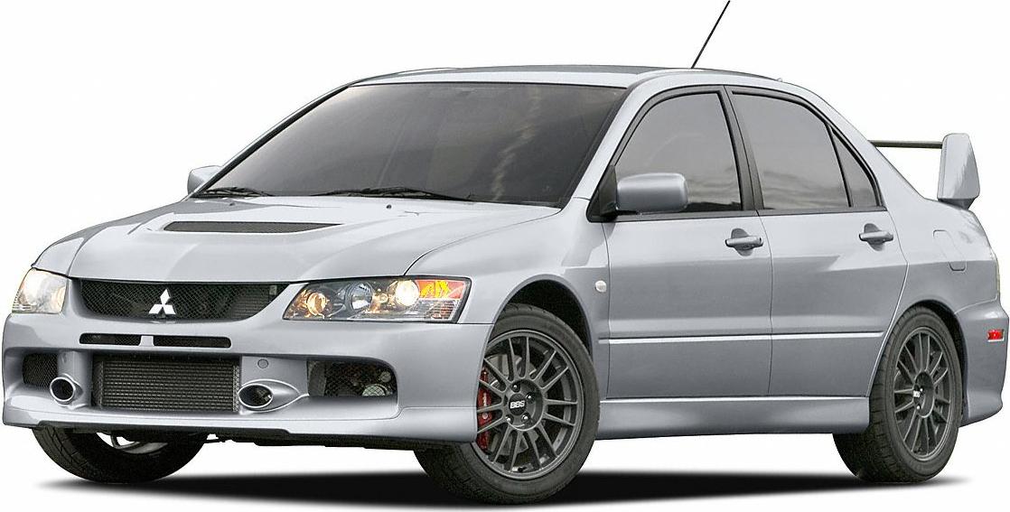 Sporty front-side view with large rear spoiler and alloy wheels