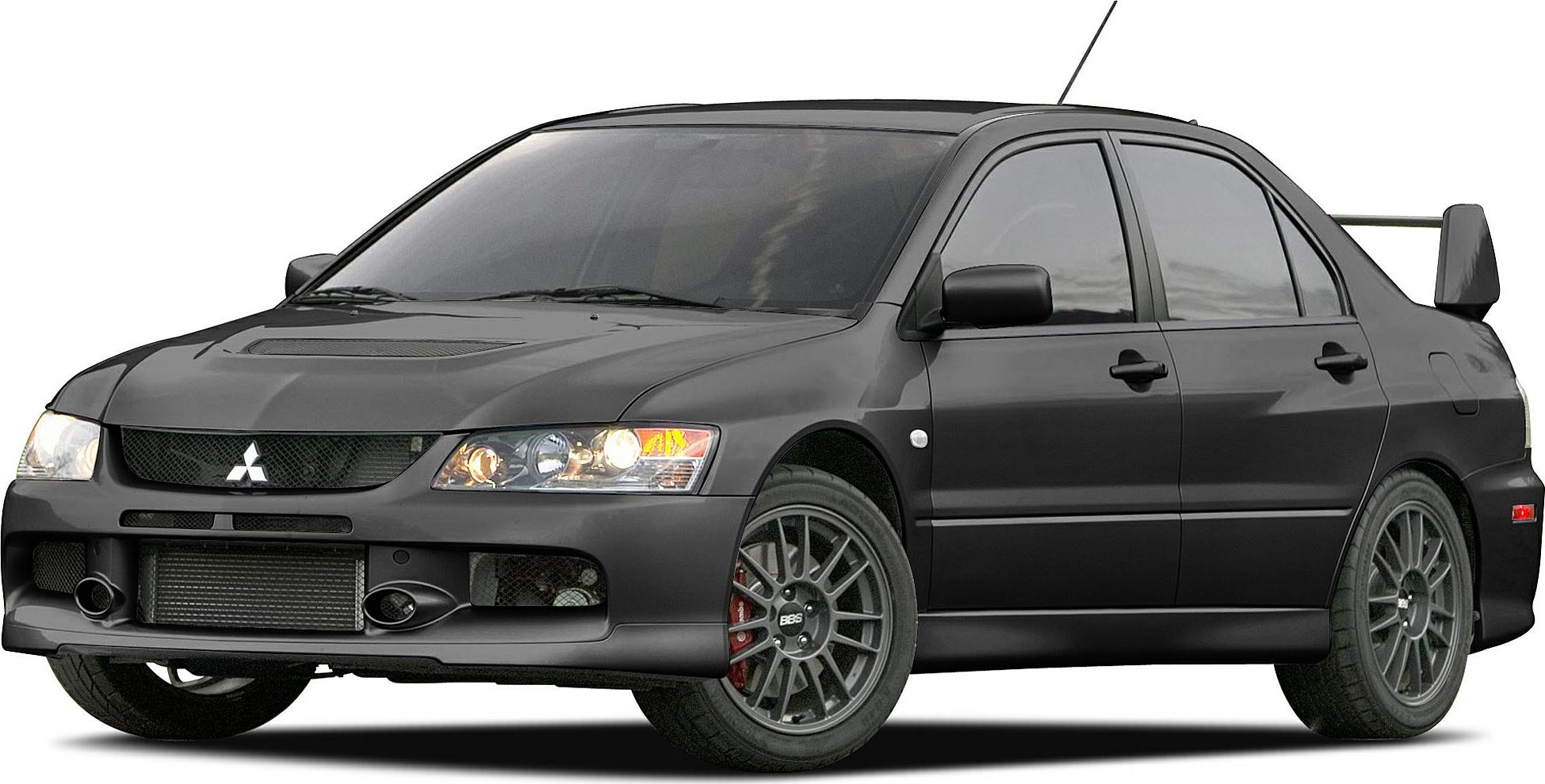 Sporty sedan front side with aggressive fascia and rear wing