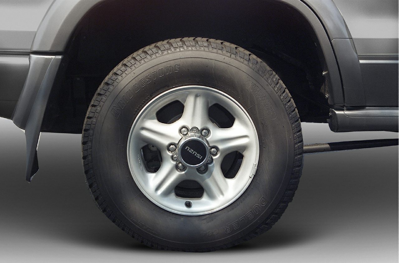 Alloy wheel with Bridgestone Dueler tire on SUV