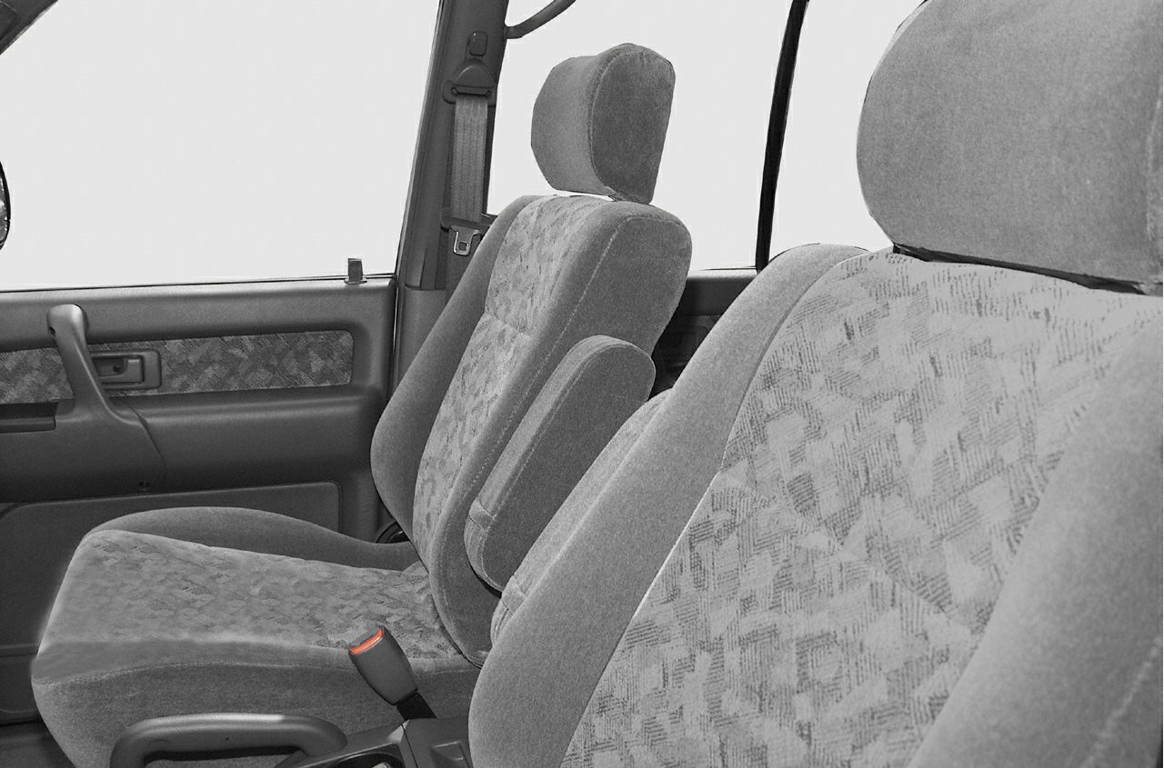 Soft fabric front seats and door panel with armrest and headrests.
