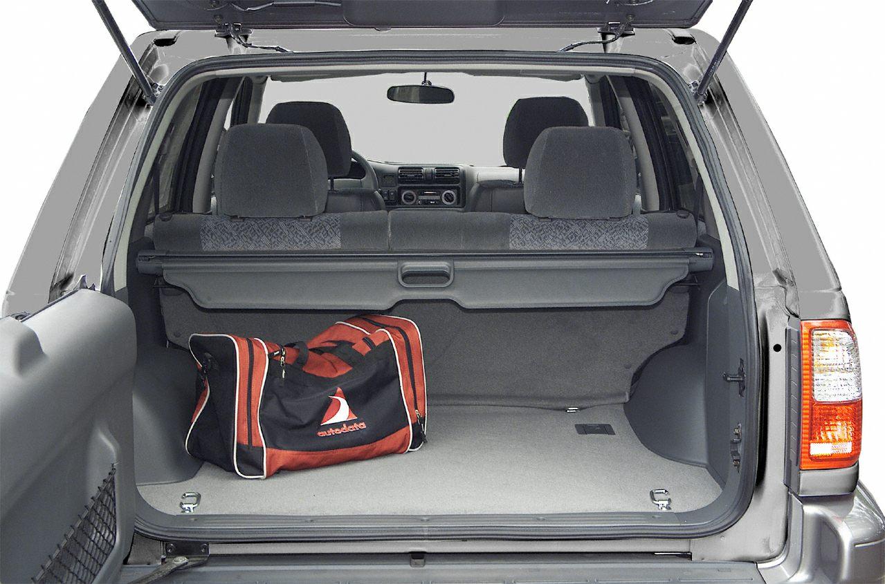 Open rear cargo space with foldable seats and a duffel bag