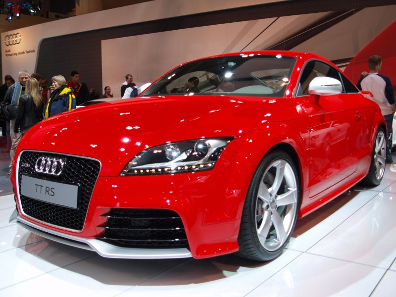 Red sports coupe with distinctive front grille and LED headlights