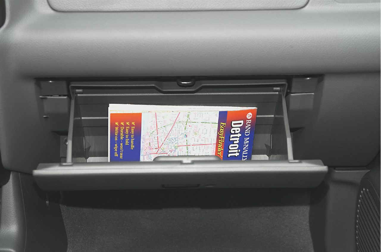 Open glove compartment with map inside