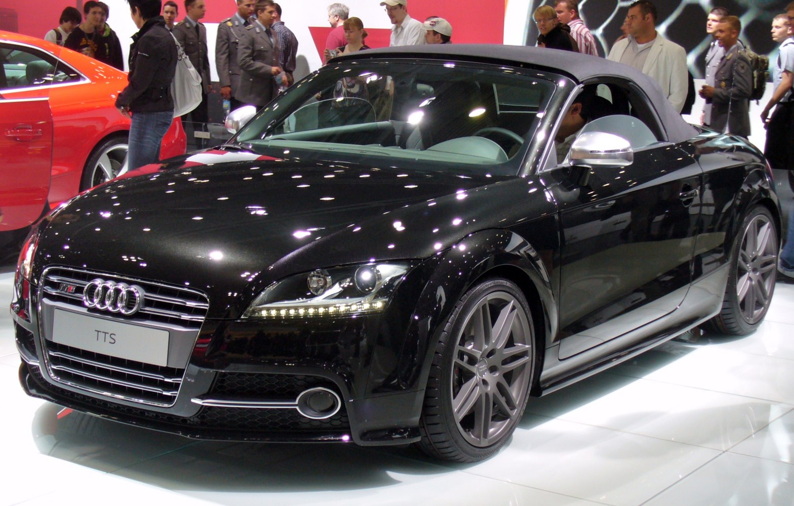 Black convertible roadster with LED daytime running lights and alloy wheels