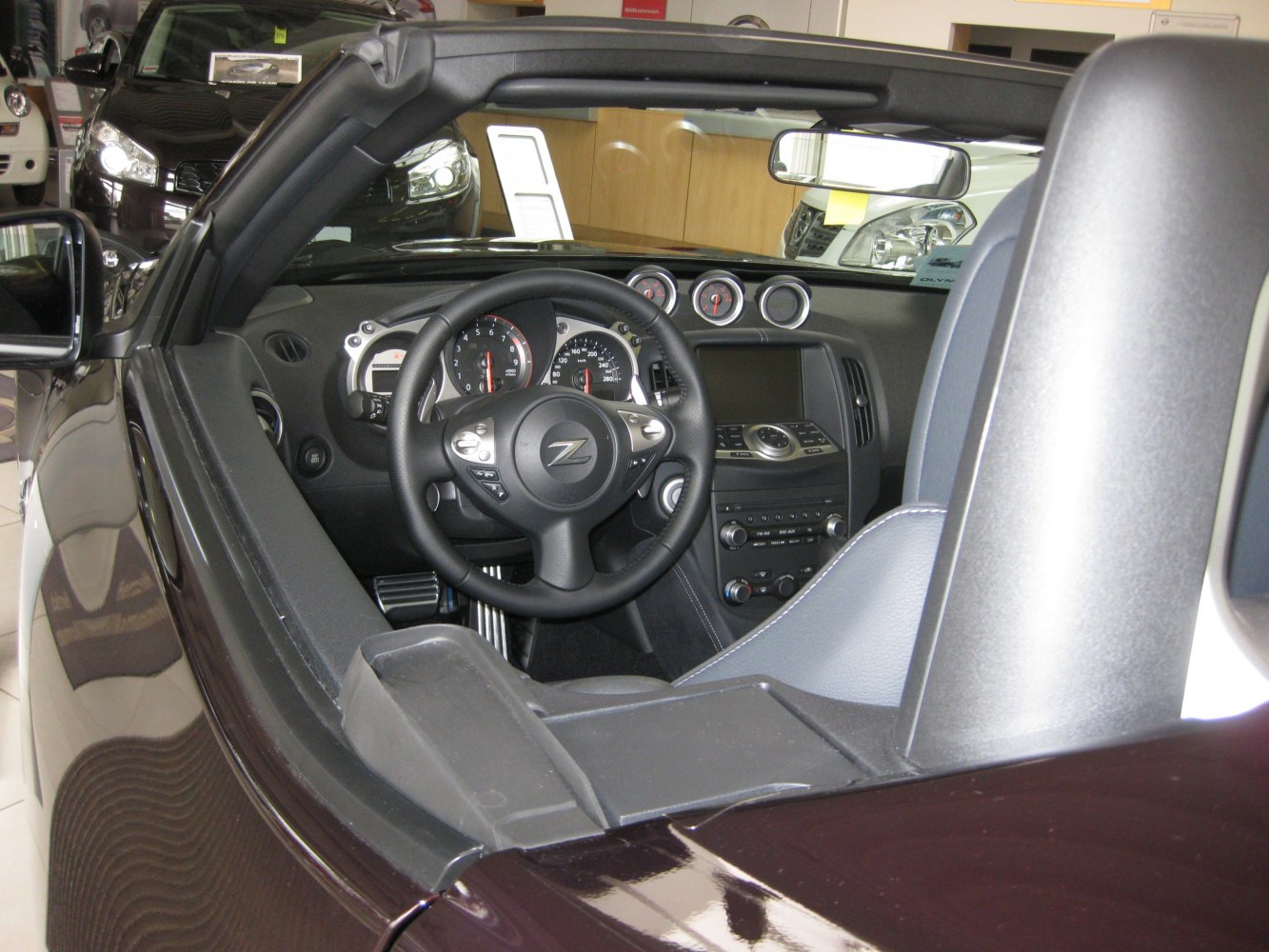 Dashboard and steering wheel inside a convertible sports car