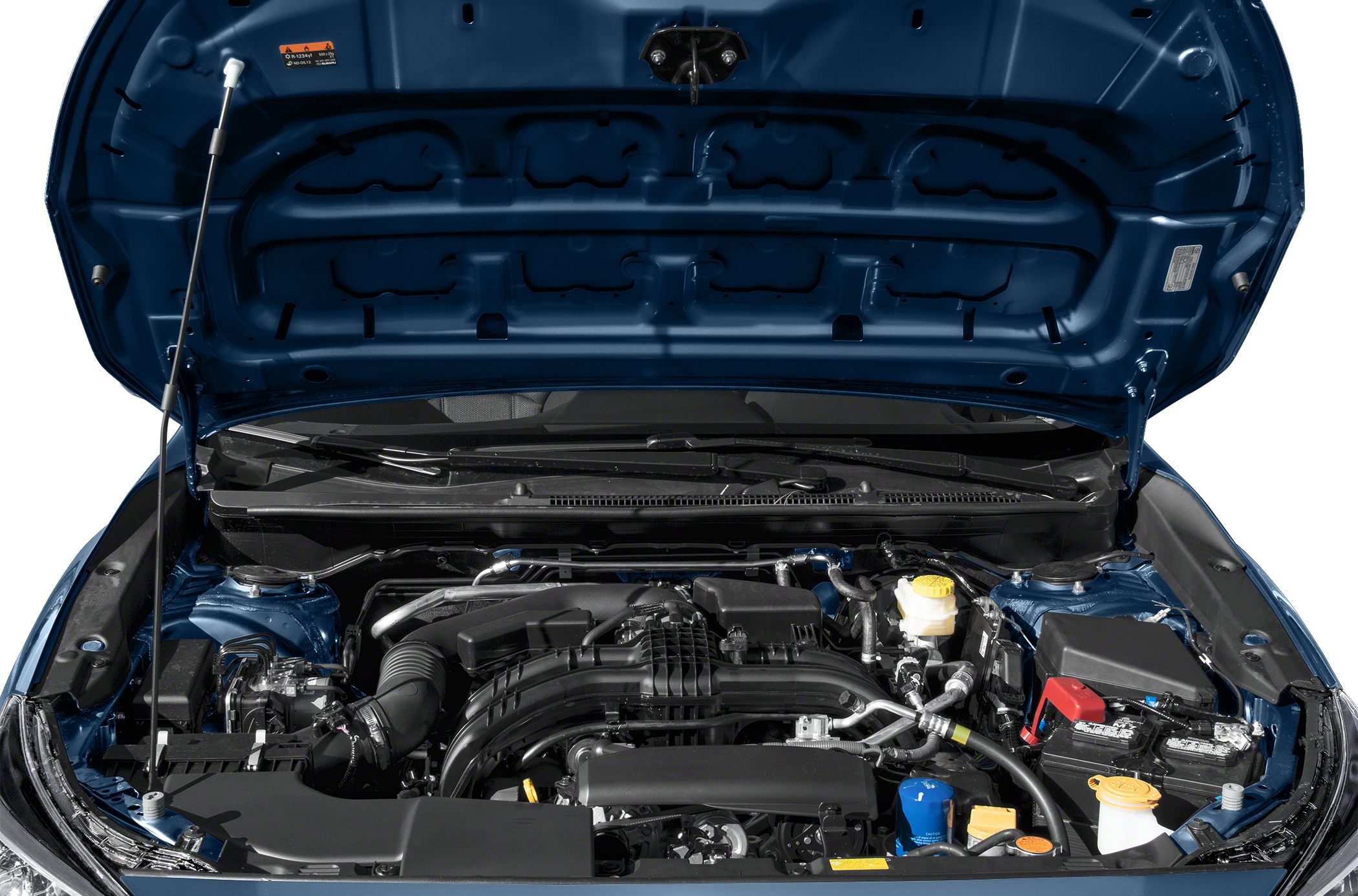 Engine compartment with visible intake, plumbing, fluid reservoirs, and wiring