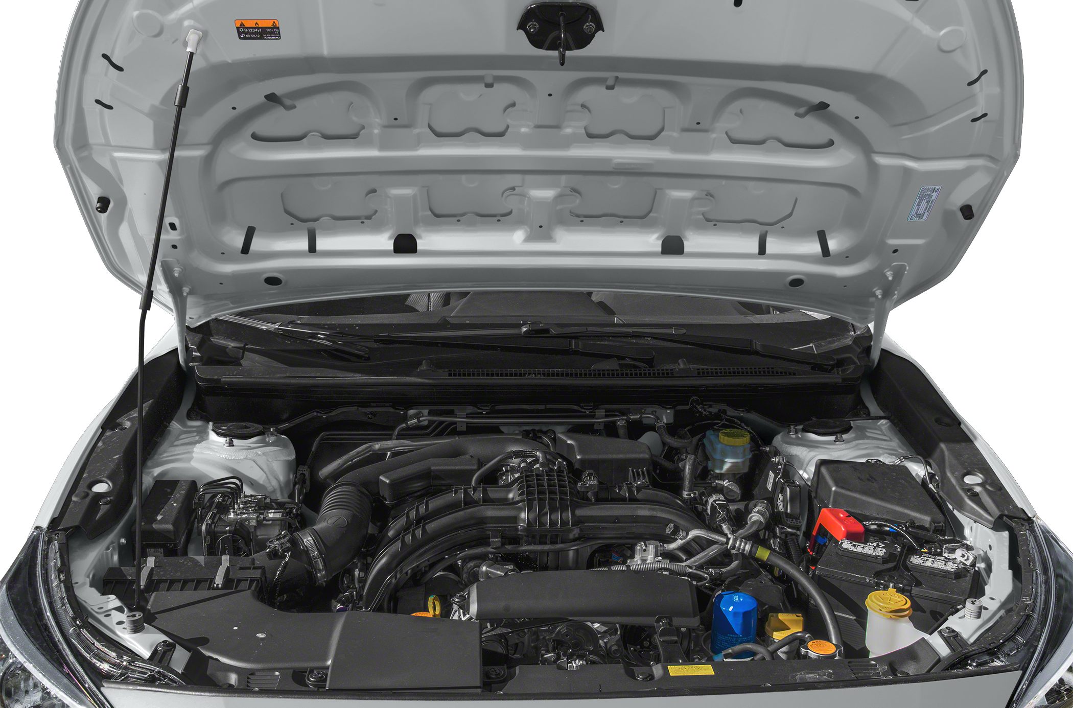 Detailed engine bay with components and battery visible