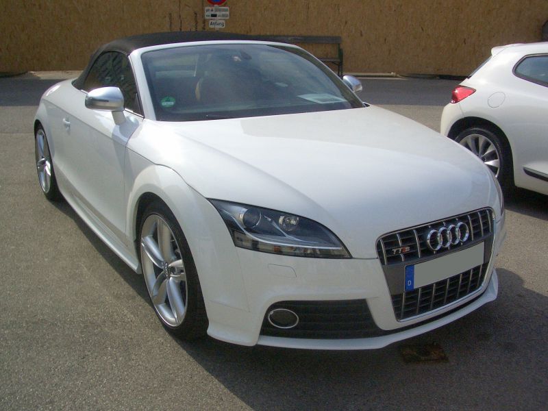 White convertible roadster with distinctive grille and sporty front design