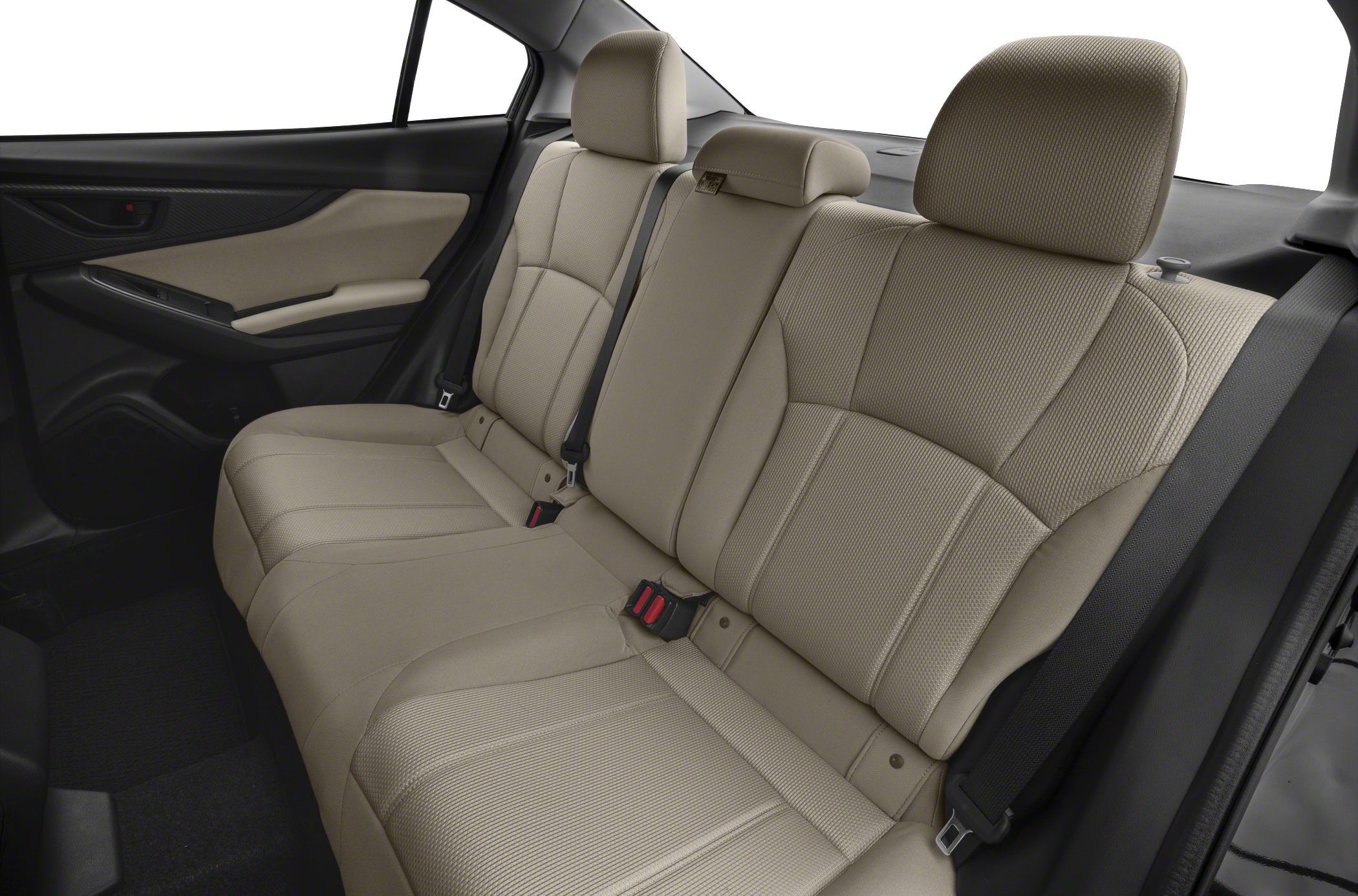 Beige rear seat upholstery and door panel interior of a sedan.