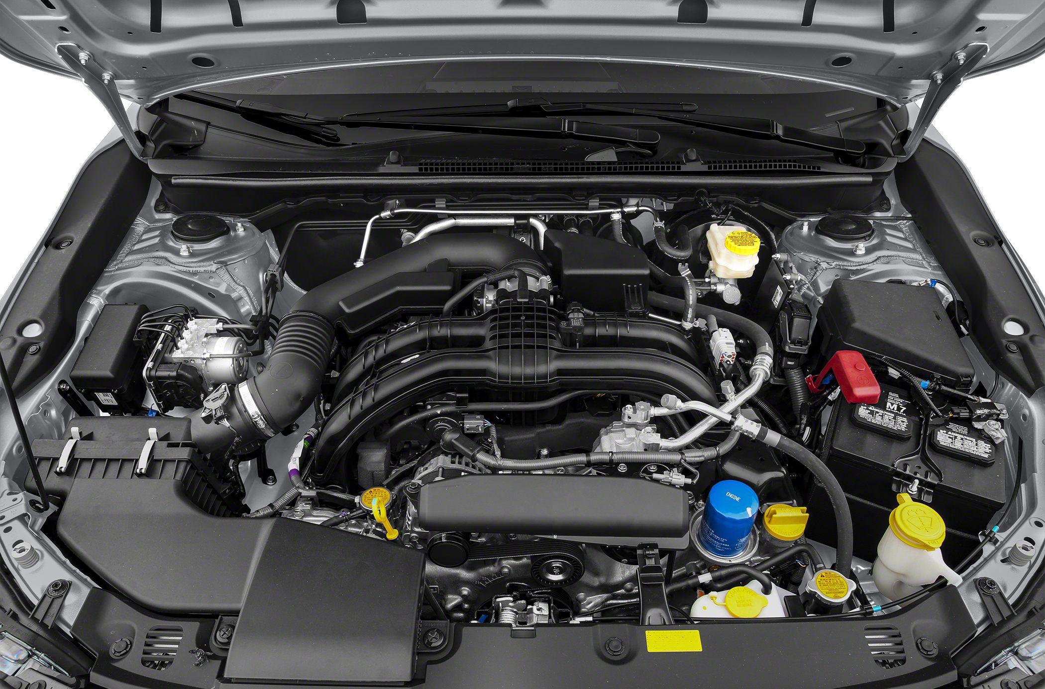 Detailed engine bay with visible intake, battery, fluid reservoirs, and hoses