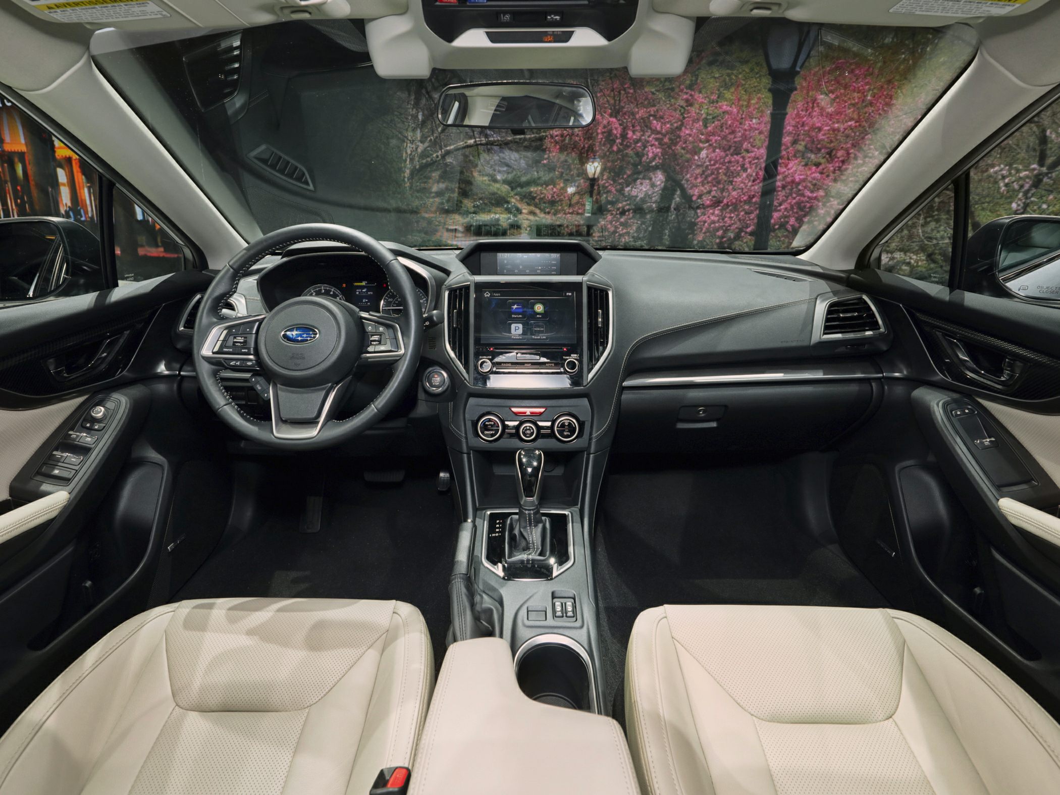Front interior view with dashboard, steering wheel, and center console