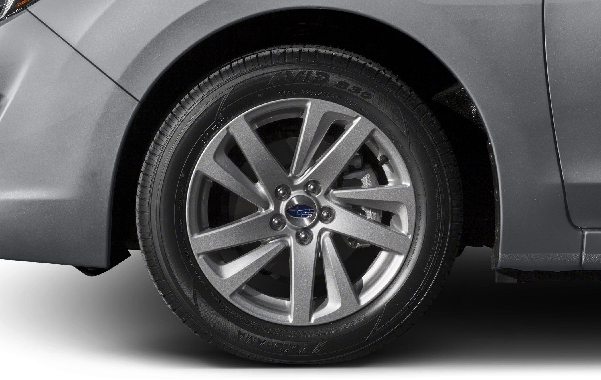 Alloy wheel and tire close-up of a sedan's front wheel