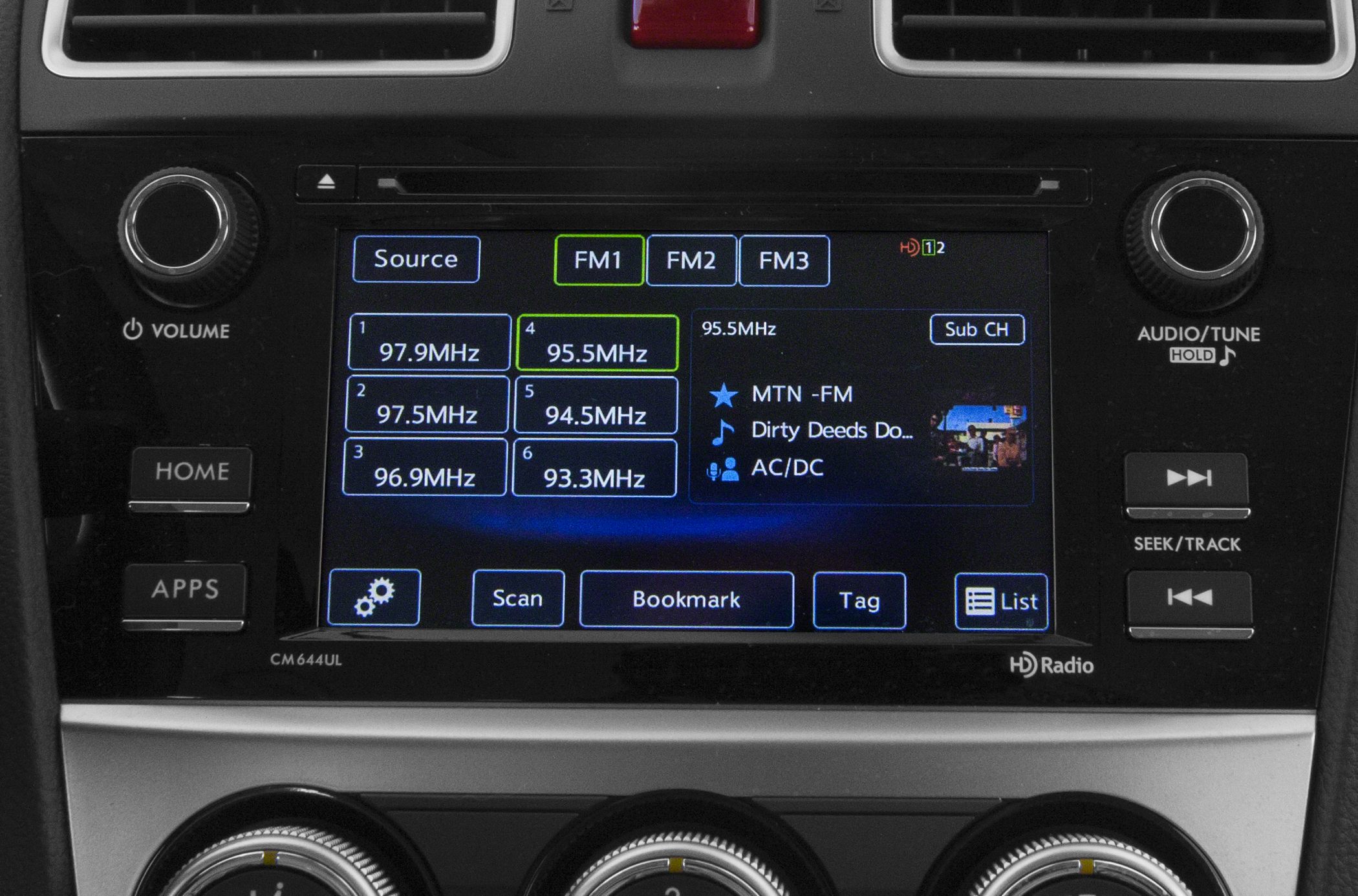 Close-up of car infotainment display and control knobs
