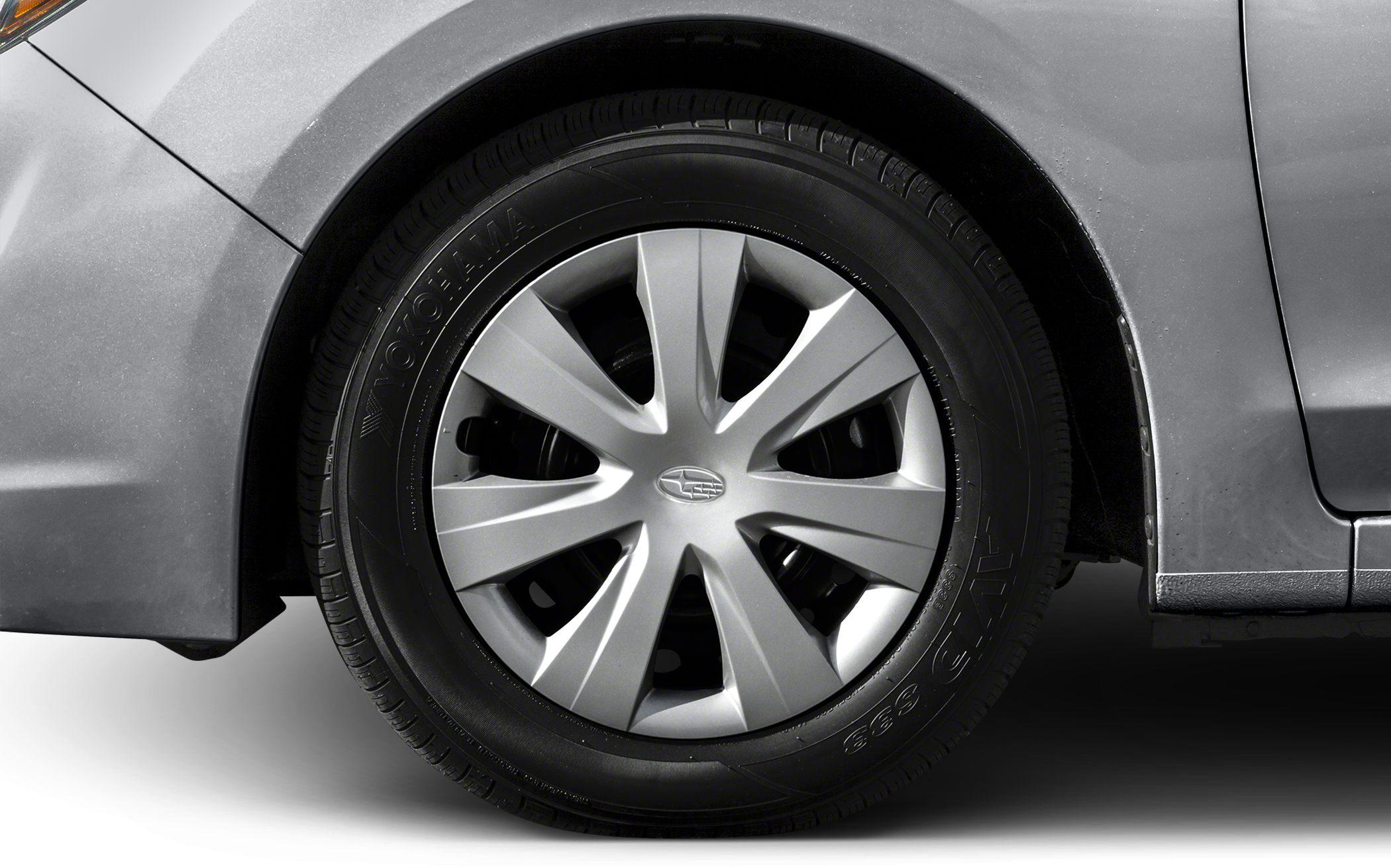 Close-up of a ten-spoke alloy wheel with Yokohama tire on a hatchback.