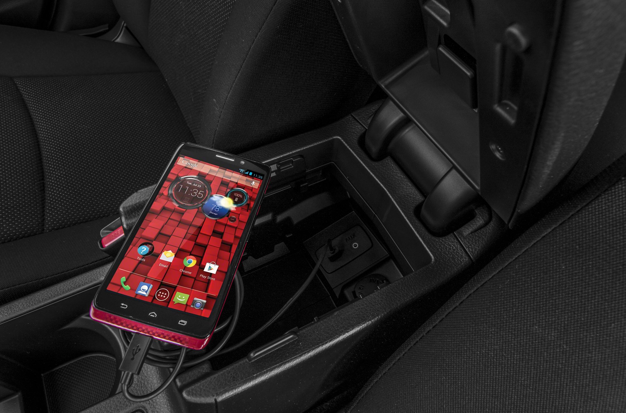 Center console USB port with smartphone charging cable.
