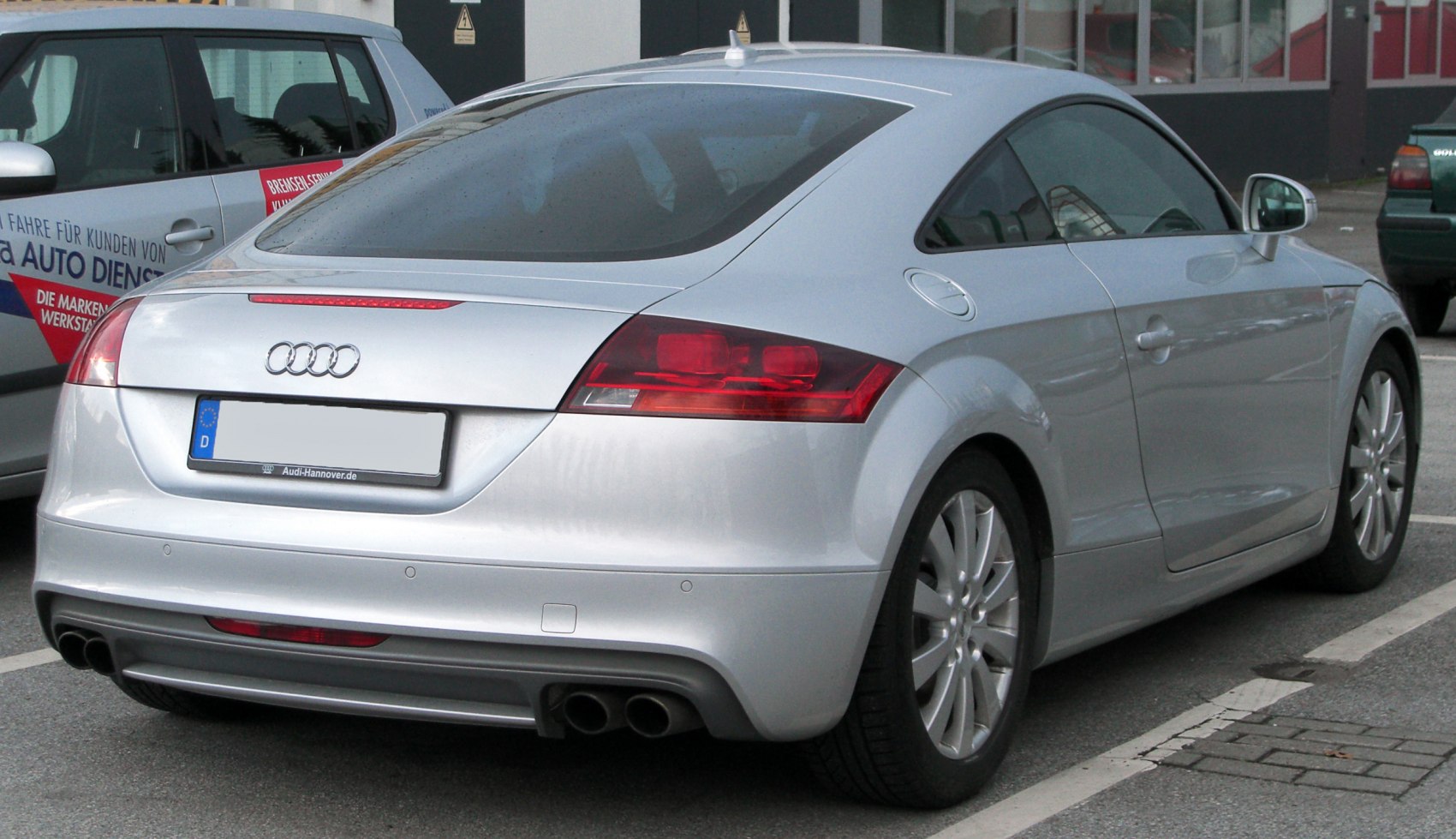 Rear view of sporty coupe with dual exhaust and LED taillights