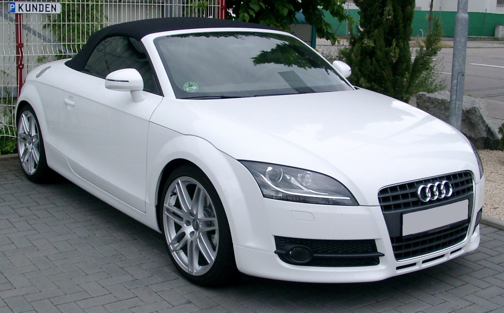 White convertible with sport alloy wheels and distinctive front grille