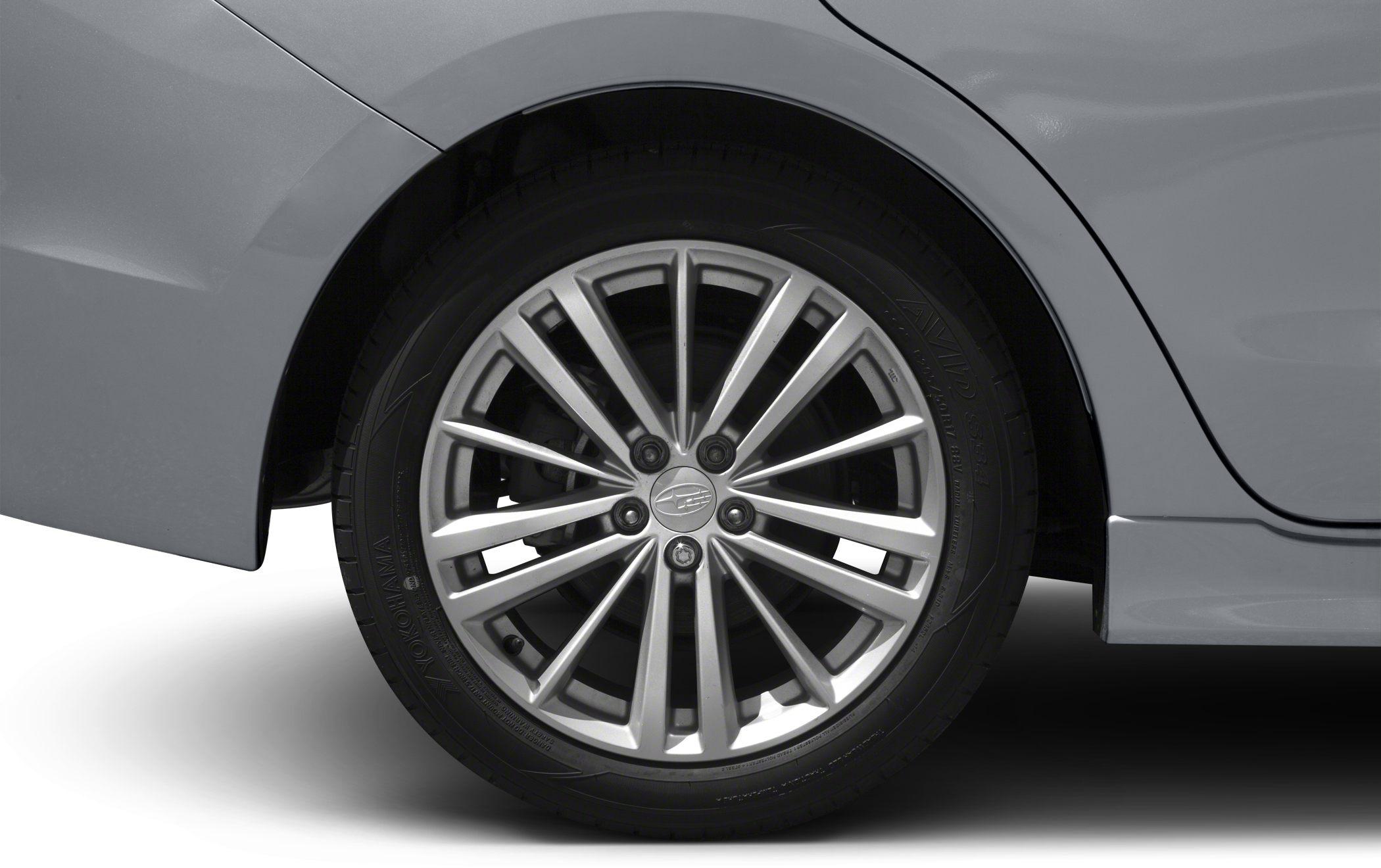 Multi-spoke silver alloy wheel with Yokohama tire.