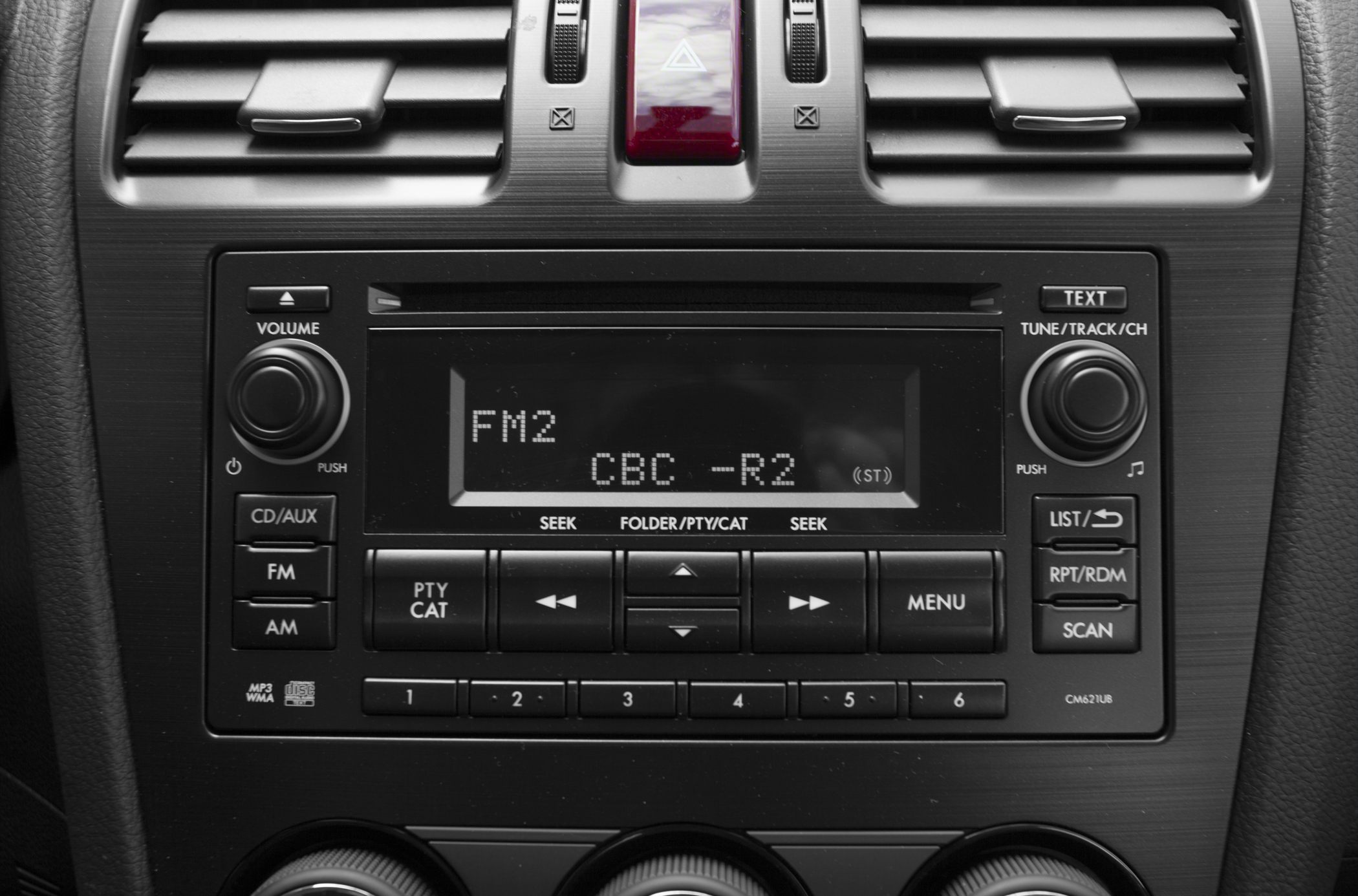 Car audio system and dashboard controls with radio display and knobs