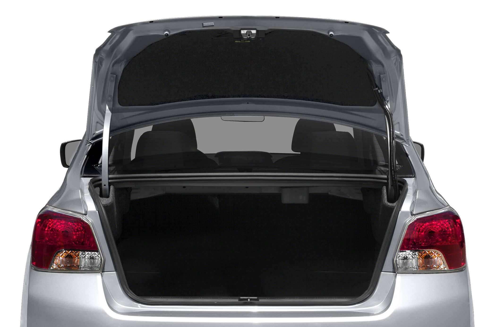 Open sedan trunk with visible cargo space and tail lights