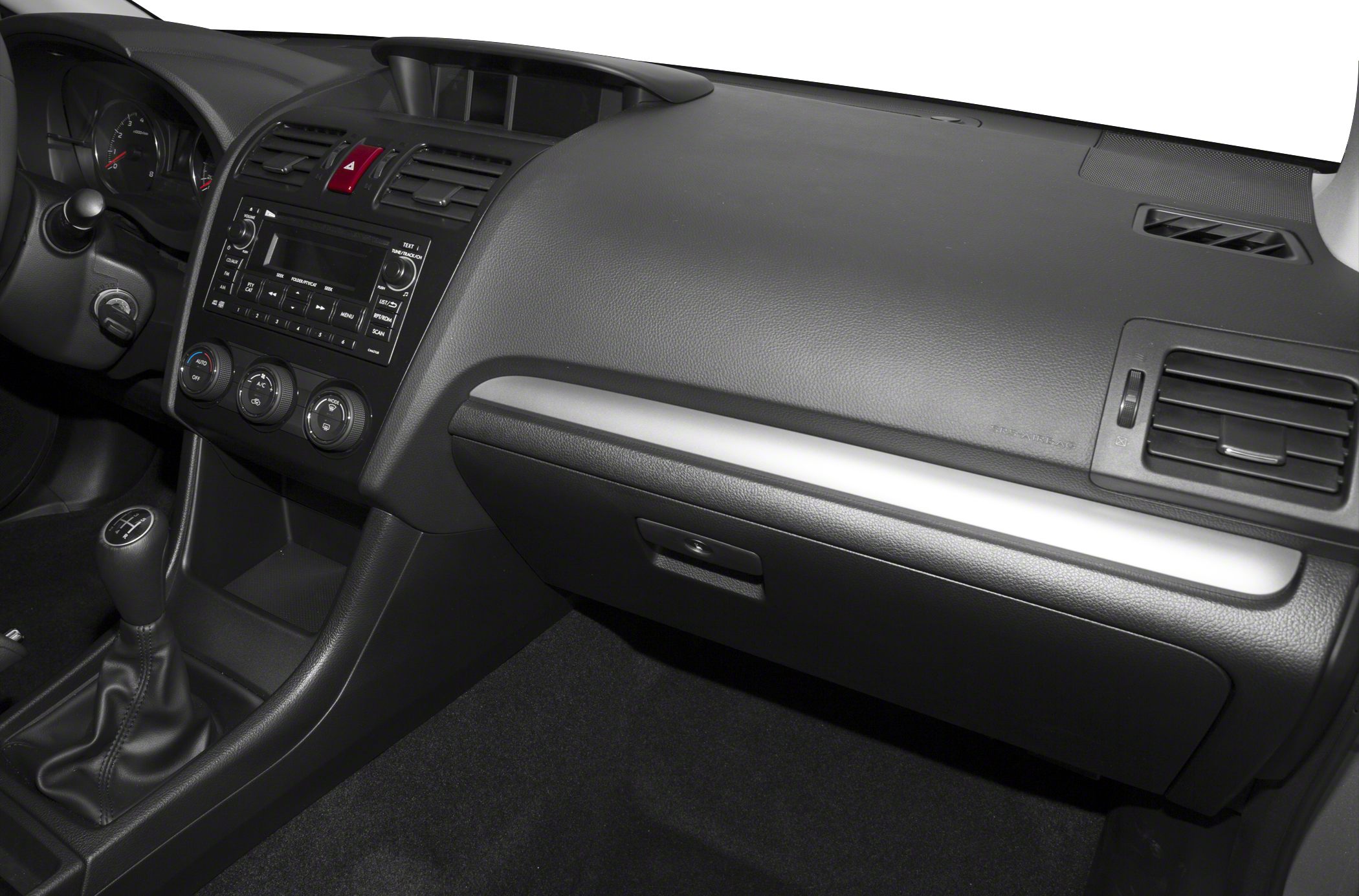 Dashboard, manual gear lever, and air conditioning controls interior view