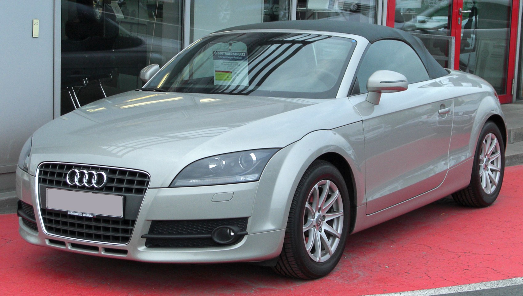 Front view of a convertible with signature grille and soft top