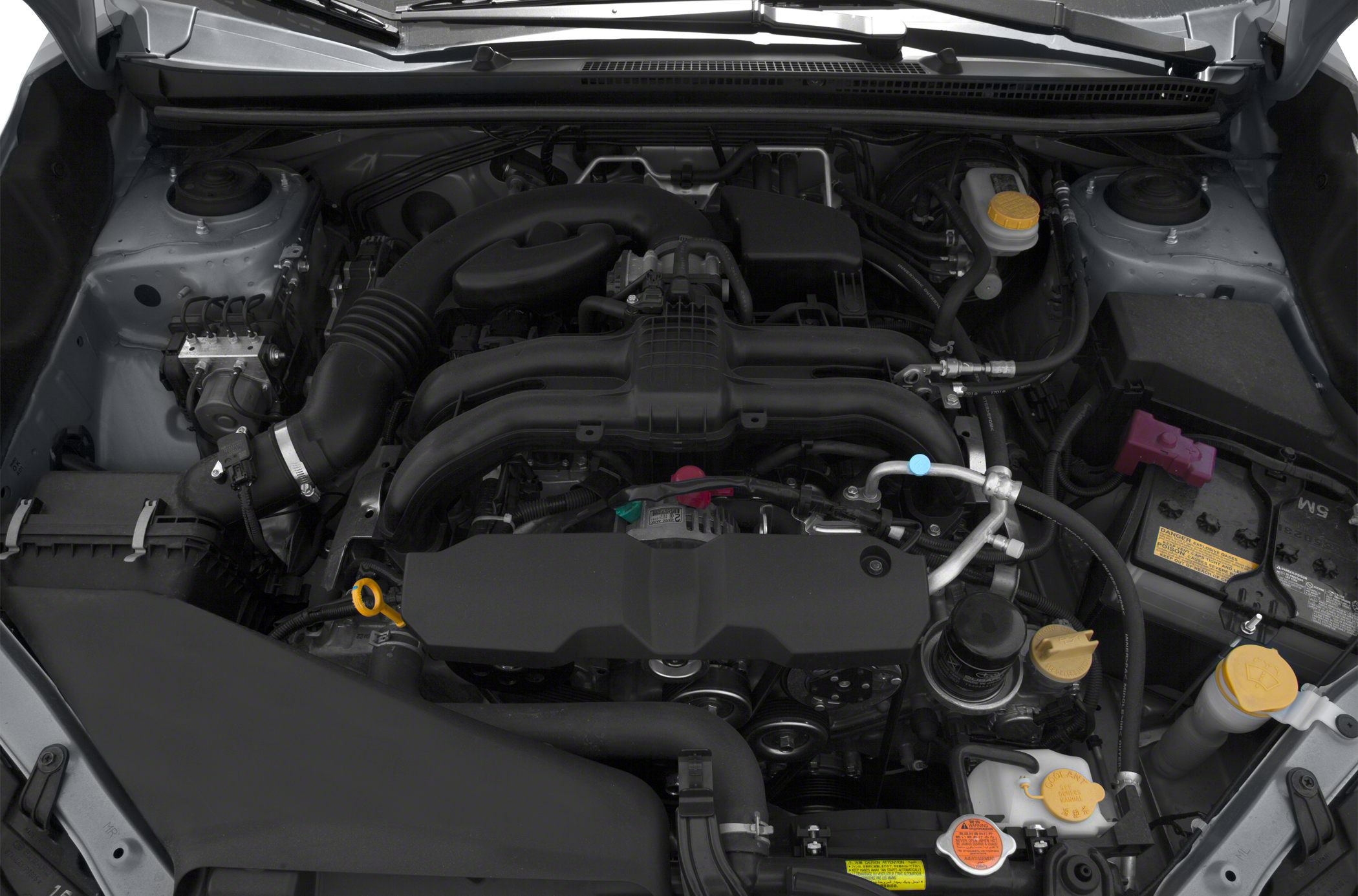 Close-up view of engine bay with visible air intake and fluid caps