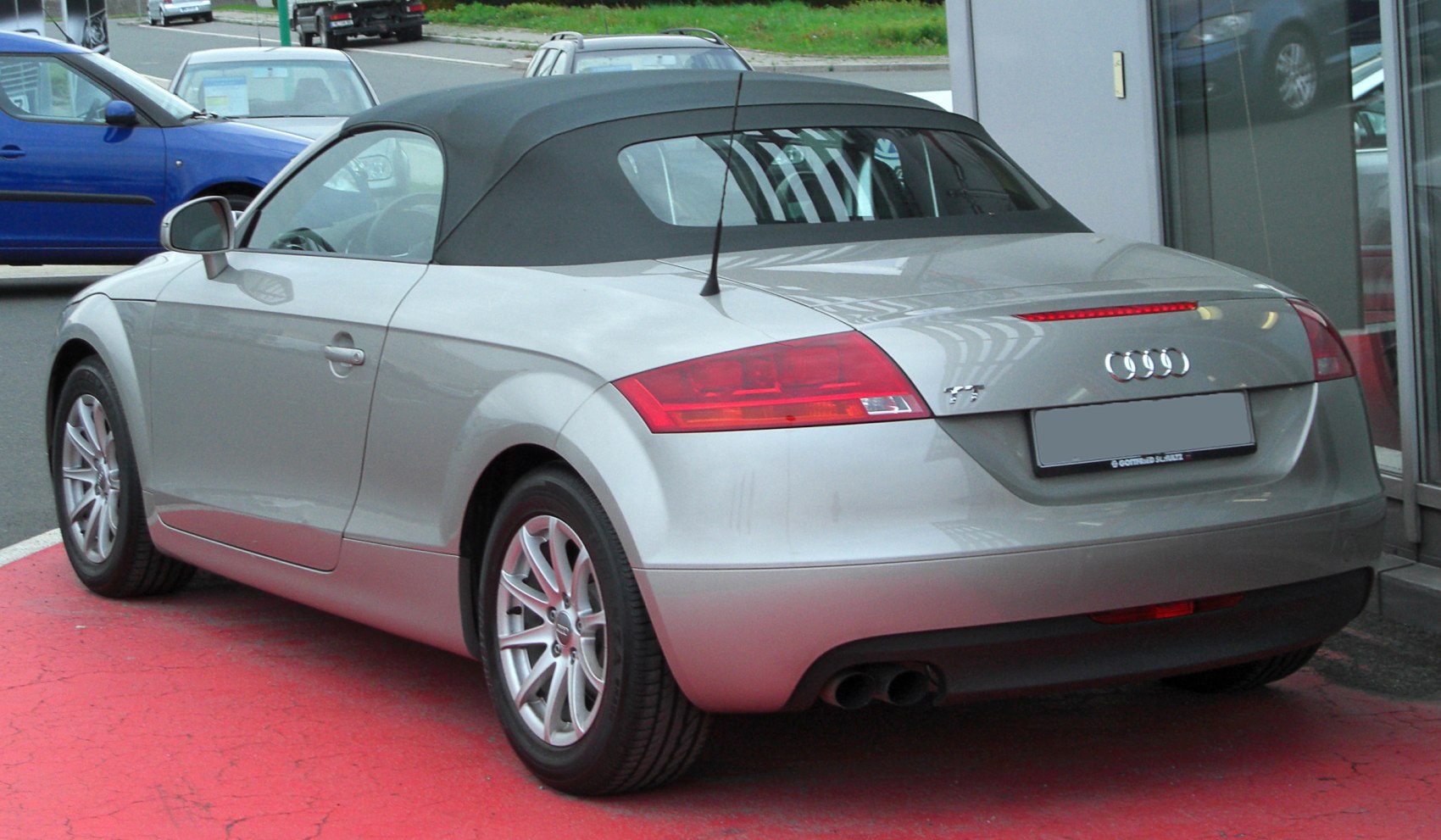 Rear view of convertible soft top with dual exhaust and tail lights