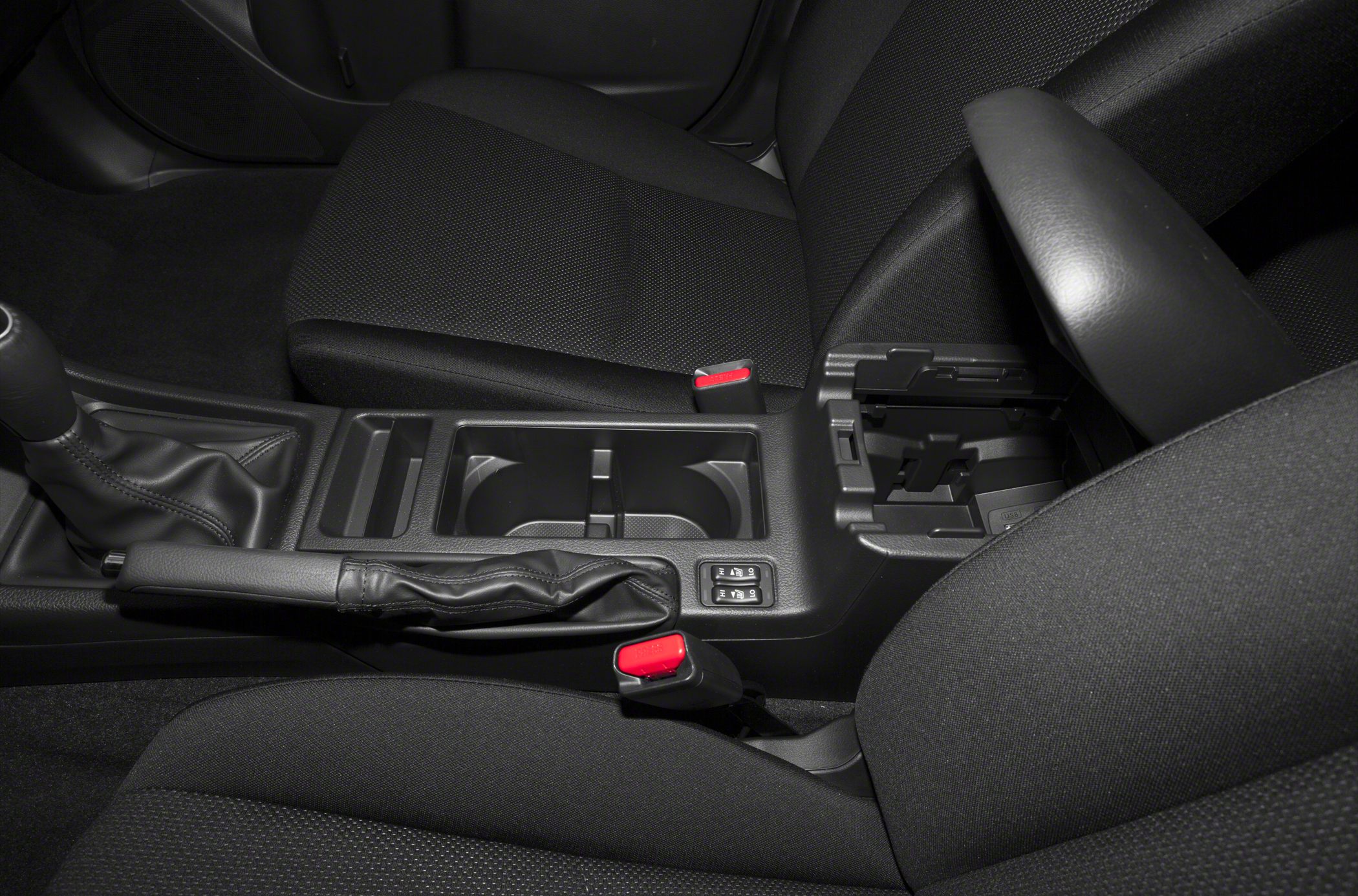 Center console with handbrake and fabric seats