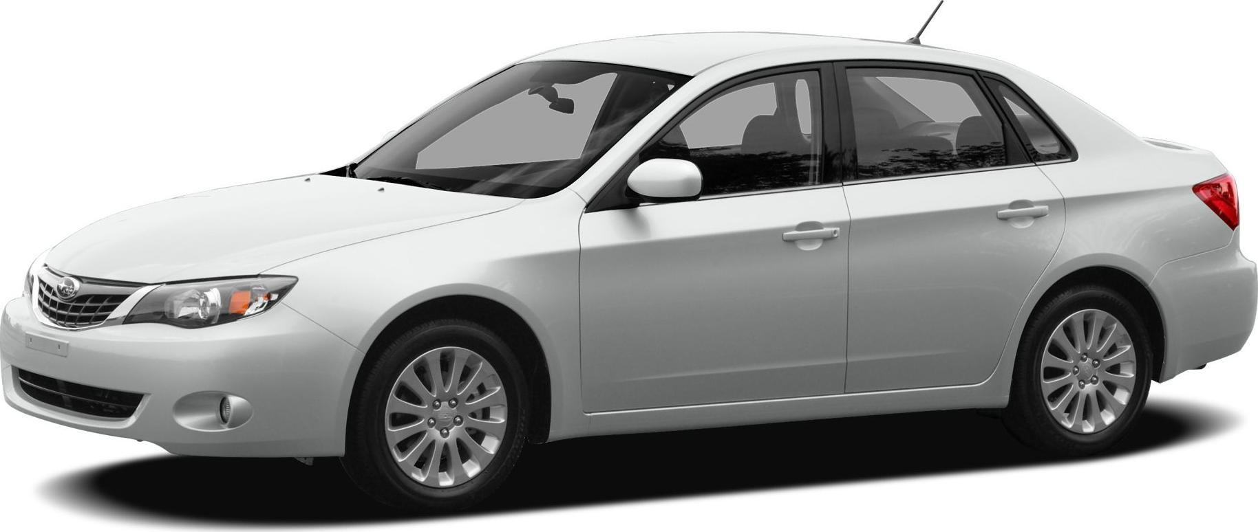 White four-door sedan front-three quarter view with alloy wheels