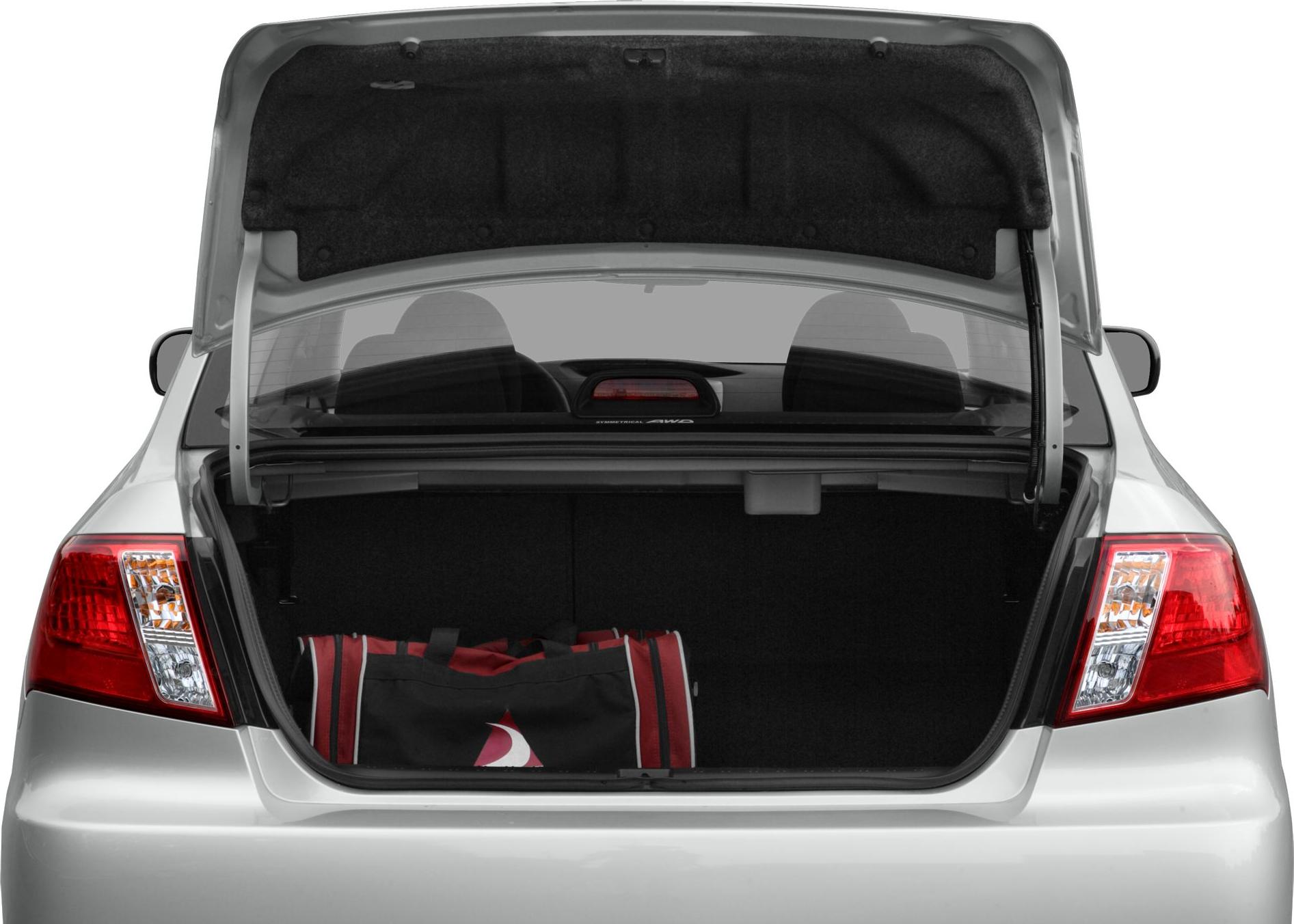 Open sedan trunk with visible red tail lights and luggage inside