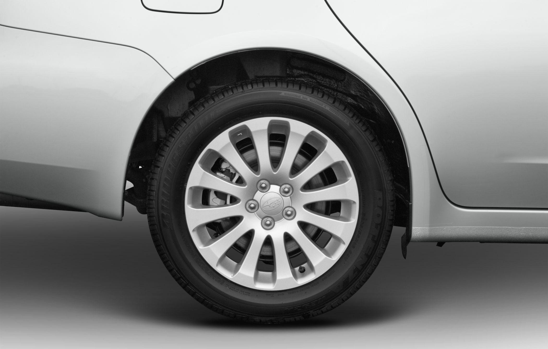 Alloy wheel and tire close-up with multi-spoke rim design.