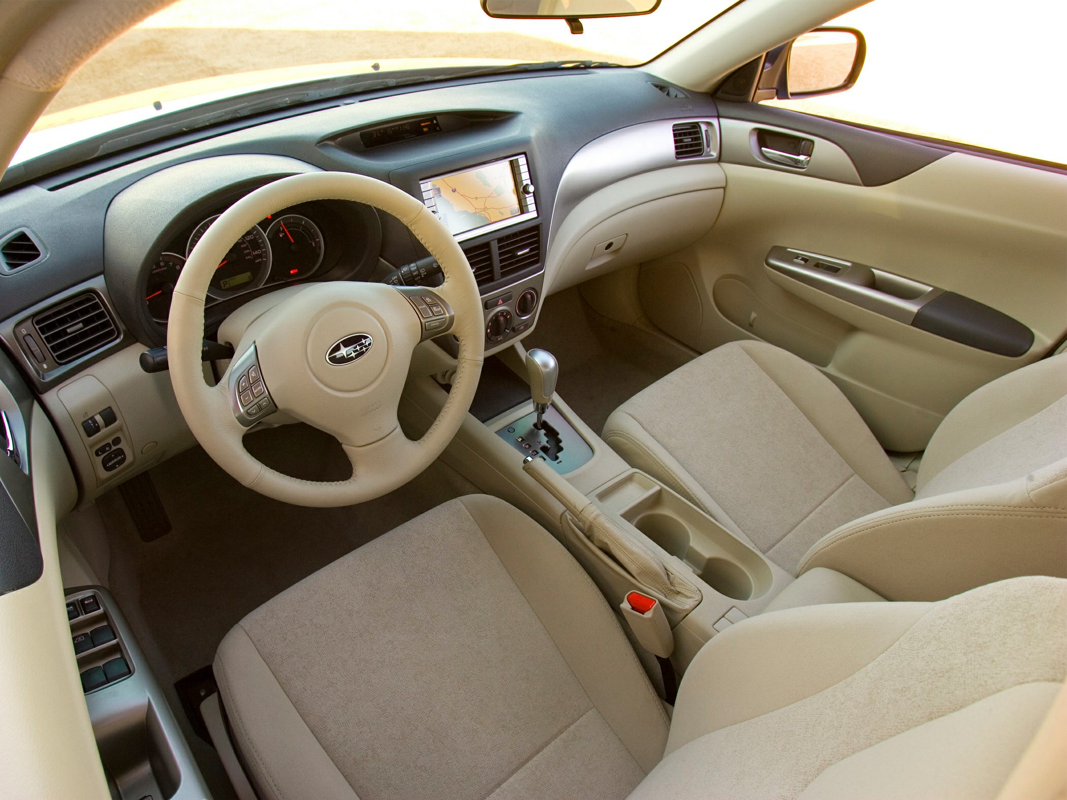 Beige interior with dashboard, steering wheel, and center console