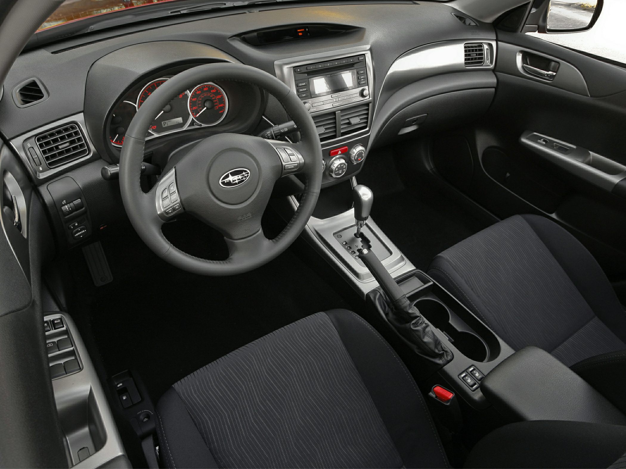 Interior view highlighting steering wheel and automatic gear shift