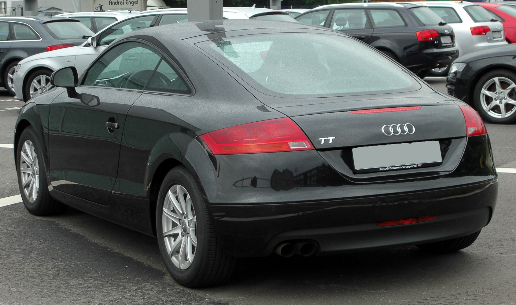 Rear side view with taillights and dual exhaust pipes