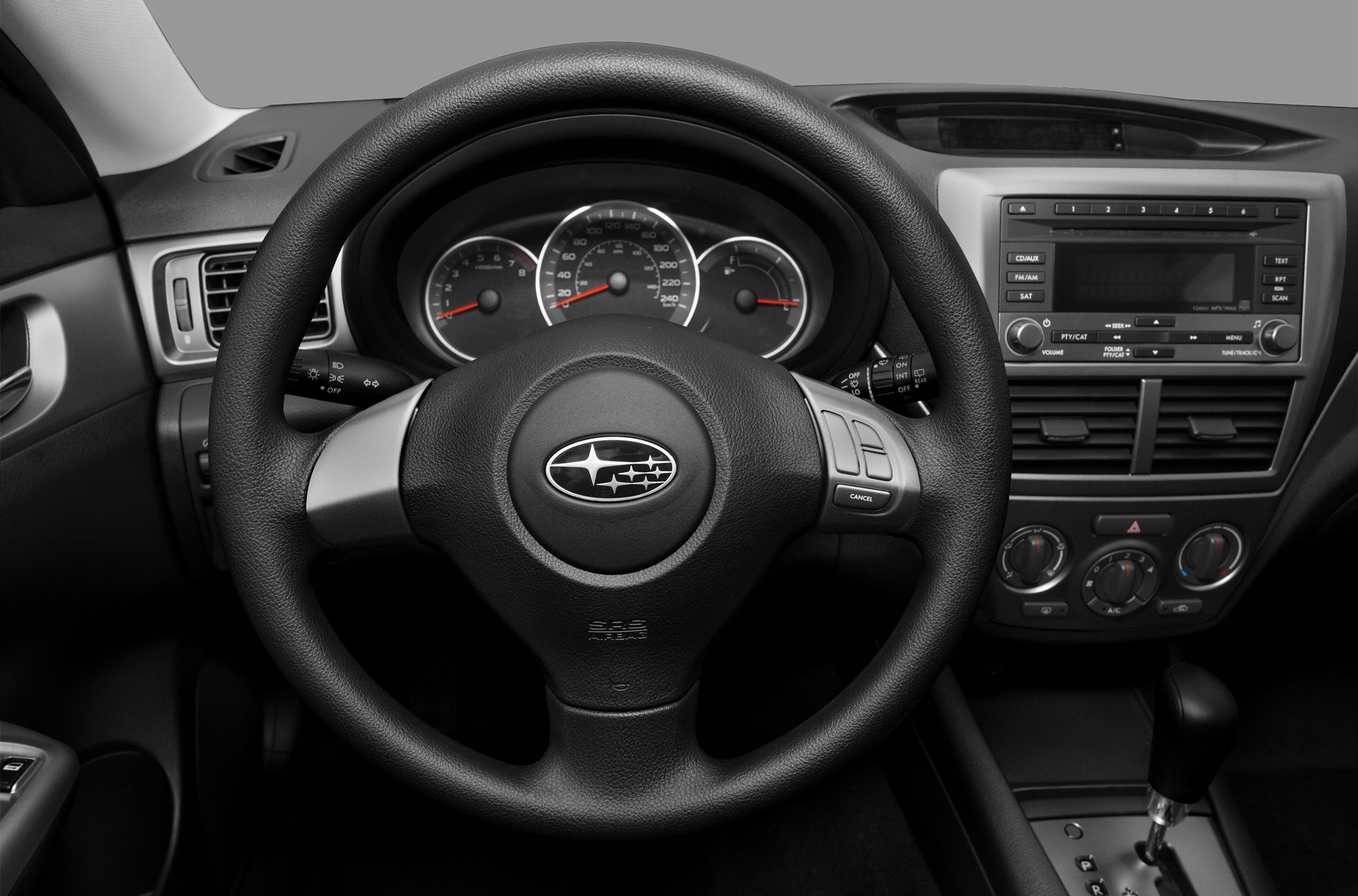 Steering wheel, instrument cluster, and center console layout in hatchback interior