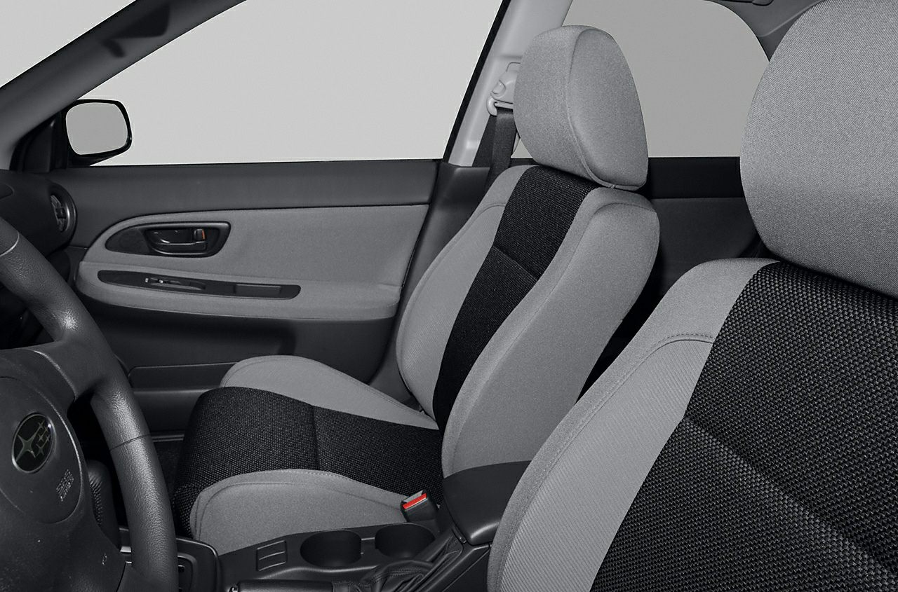 Fabric seats and door panel with steering wheel in car interior