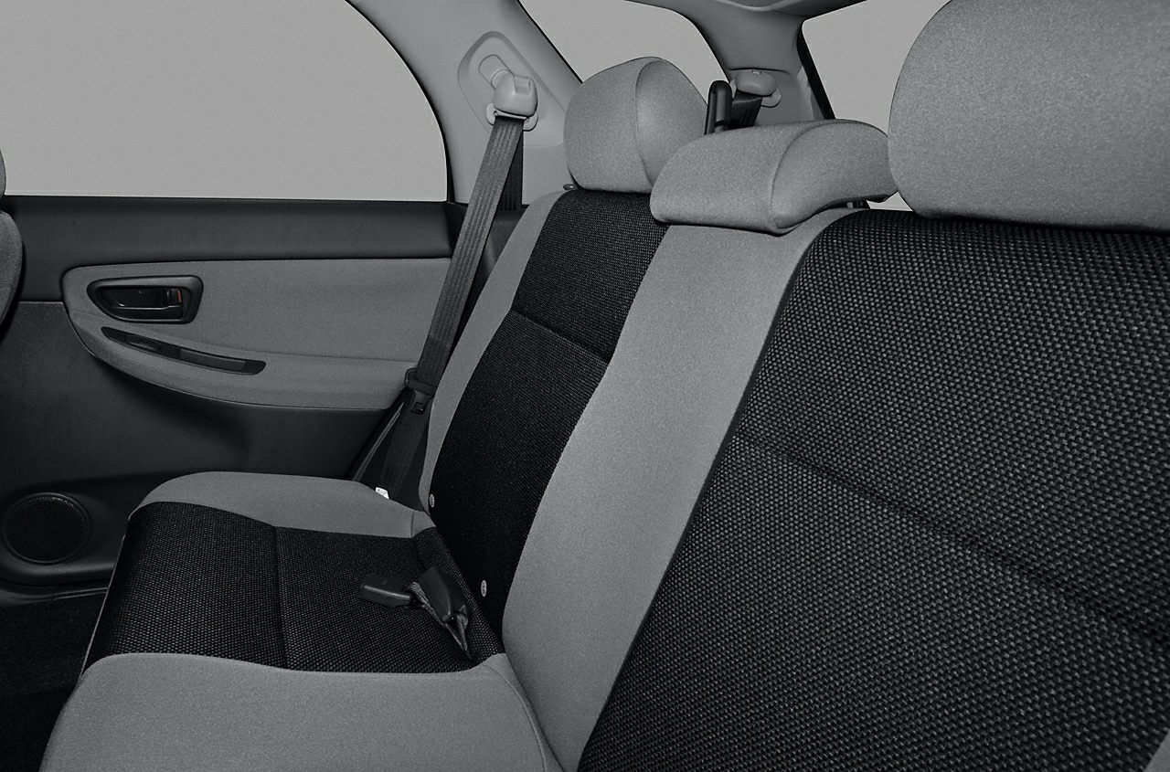 Rear seat with two-tone fabric upholstery and headrests.