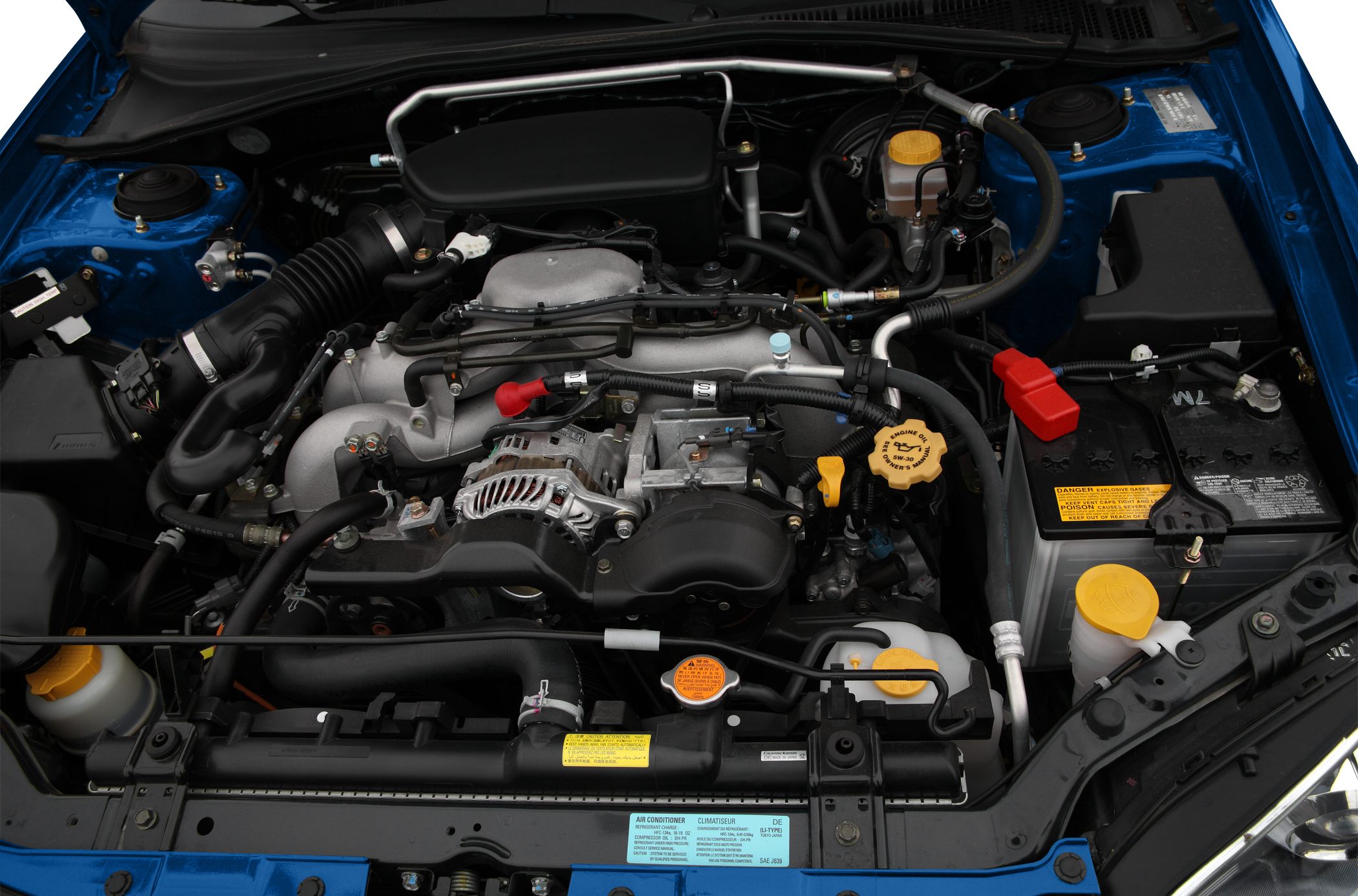 Engine bay with visible components and car battery