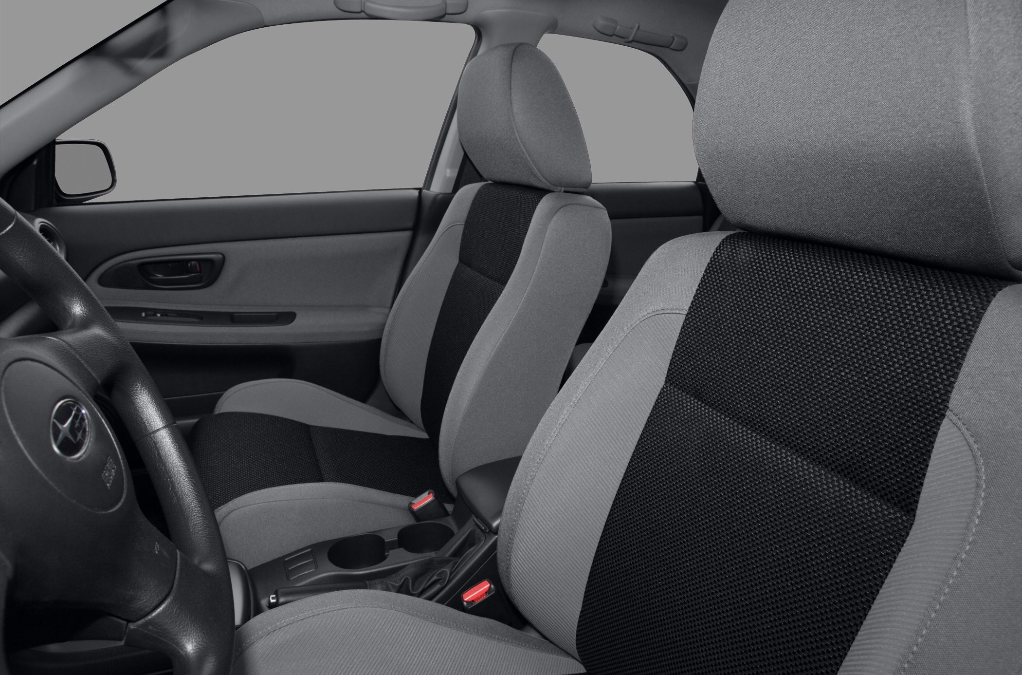 Front fabric seats and door panel with armrest and controls